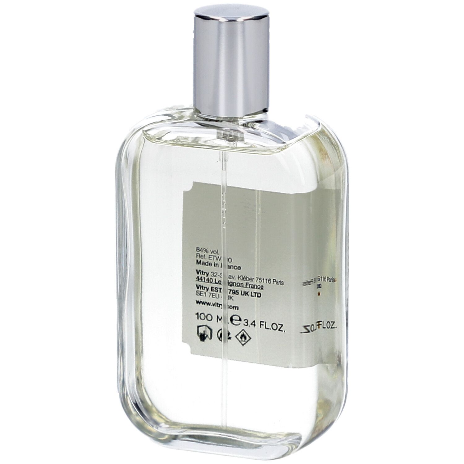 Glasflakon mit silbernem Verschluss. Rückseite mit Text und Informationen. 100 ml, 3.4 FL.OZ.