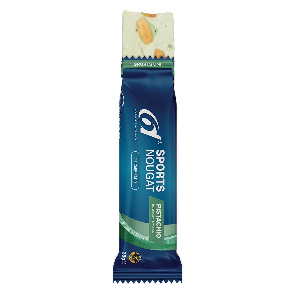 Barre bleue, partiellement ouverte, montrant du nougat aux pistaches. Inscription: Sports Nougat Pistache, 2:1 Carb Ratio.