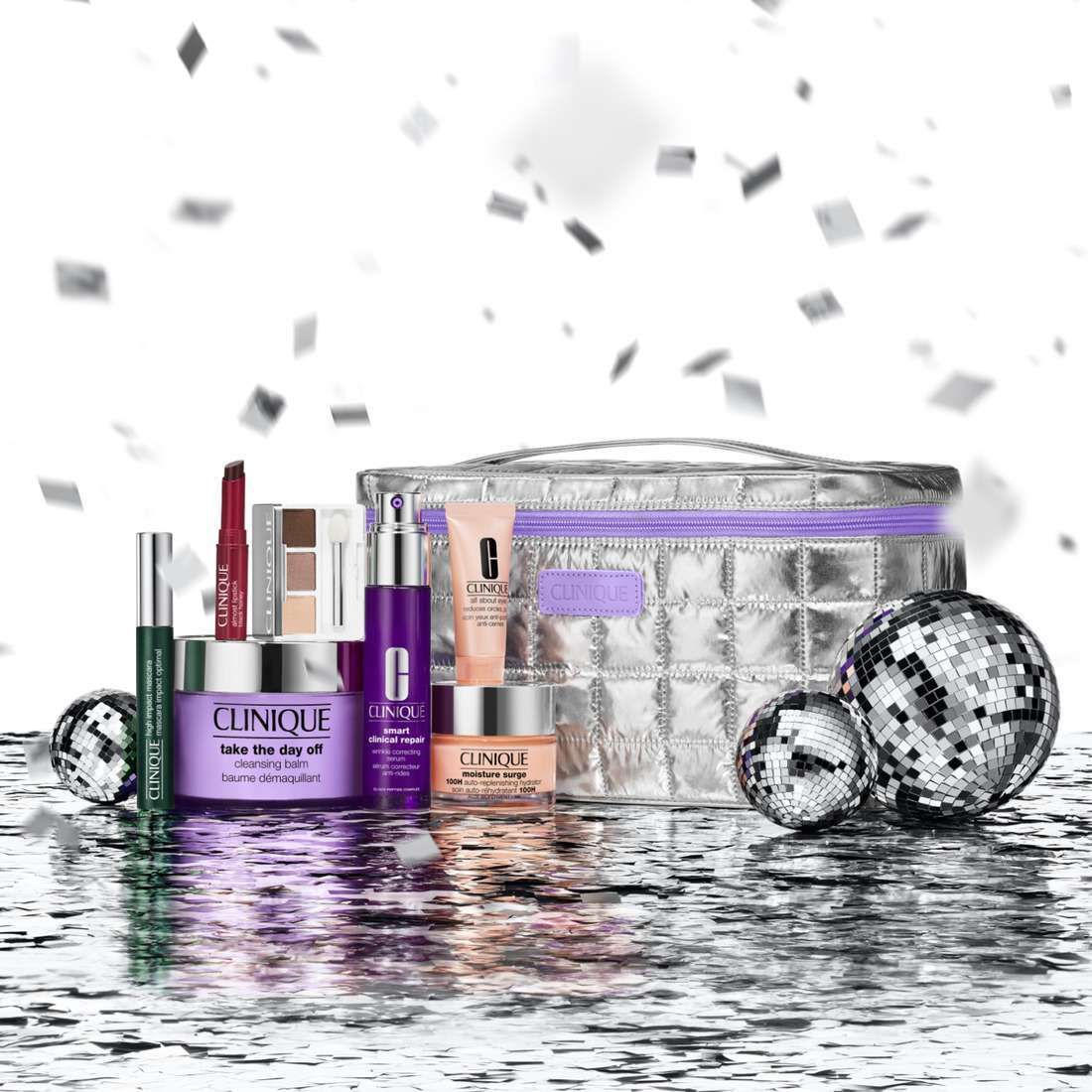 Set mit Kosmetikprodukten. Enthält Cremes, Seren, Mascara und Make-up-Tasche. Konfetti.