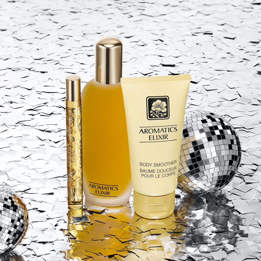 Trois produits : flacon, tube, stylo. Sur fond scintillant. Texte : Aromatics Elixir.