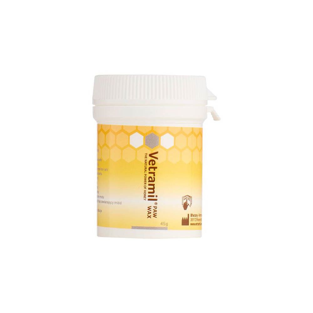 Pot blanc avec étiquette jaune-orange. Inscription: Vetramil Paw Wax. Cire au miel pour coussinets. 45g.