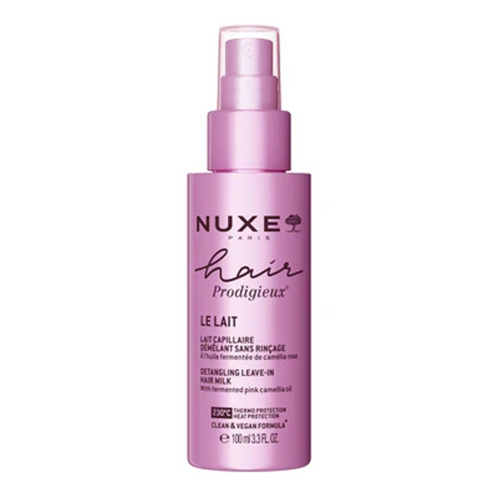 Flacon rose avec vaporisateur. Inscription: Nuxe Hair Prodigieux, Le Lait, Detangling Leave-in Hair Milk.