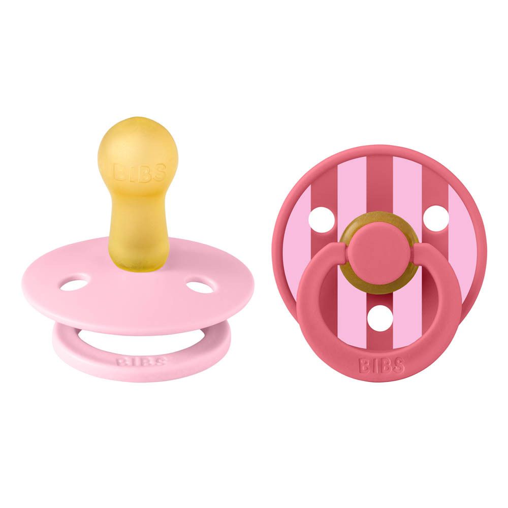 Deux sucettes roses pour bébé. Forme ronde, anneau. Logo BIBS visible.