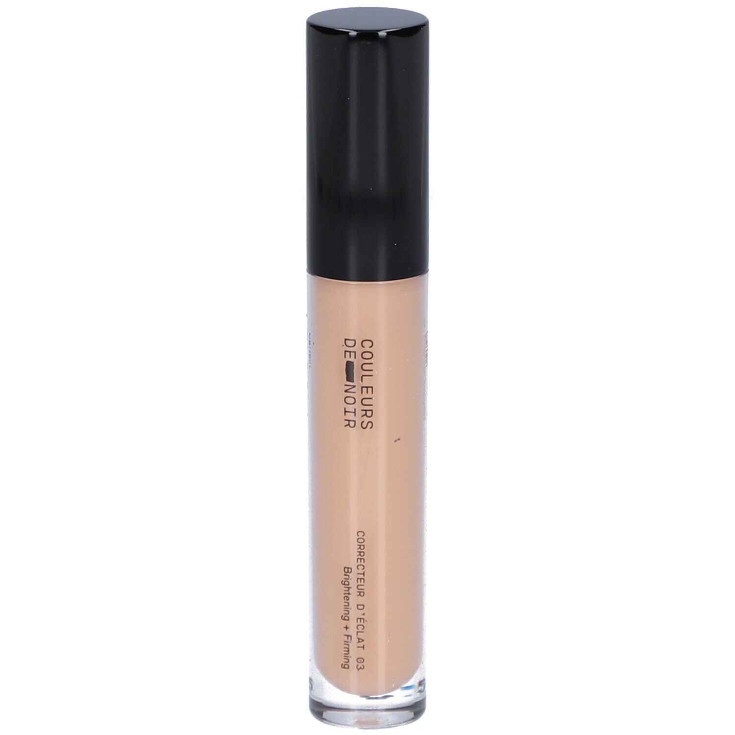 Beige Concealer-Tube mit schwarzem Deckel. Aufschrift: COULEURS DE NOIR, Correcteur d’éclat 03 Moyen. Hellt auf und strafft.