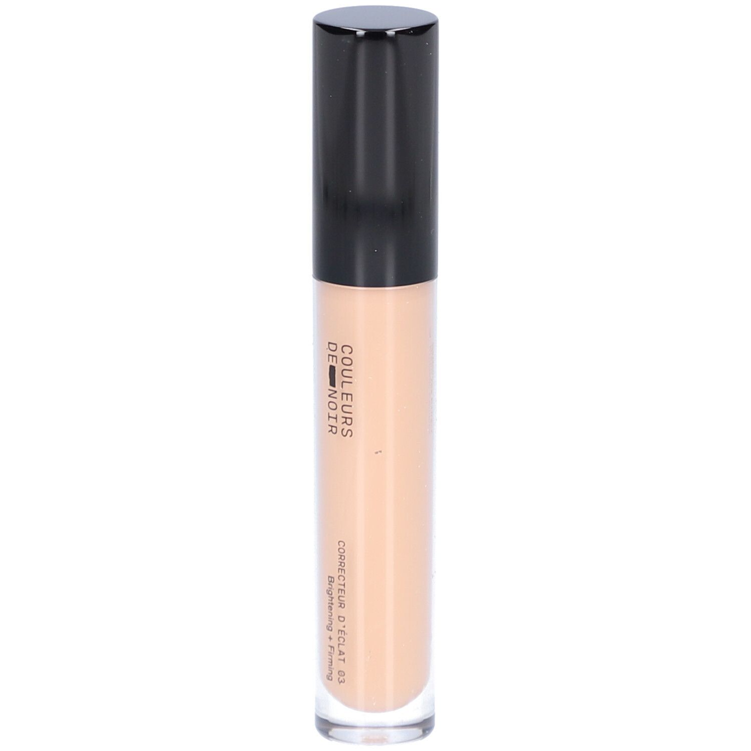 Beige Concealer-Tube mit schwarzem Deckel. Aufschrift: COULEURS DE NOIR, Correcteur d’éclat 03 Moyen. Hellt auf und strafft.