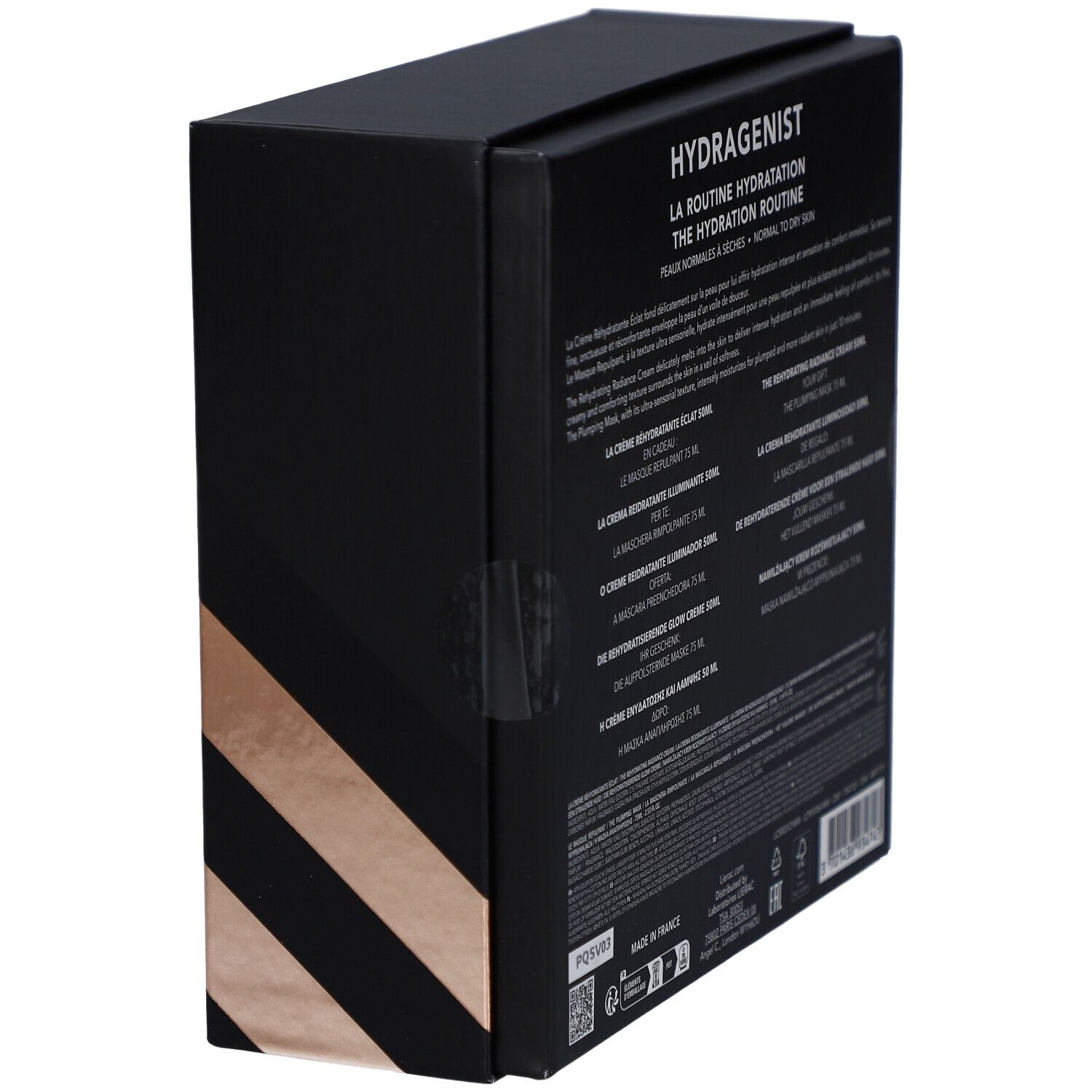 Seitenansicht einer schwarzen Geschenkbox. Text in mehreren Sprachen. Enthält Informationen zu den Produkten.