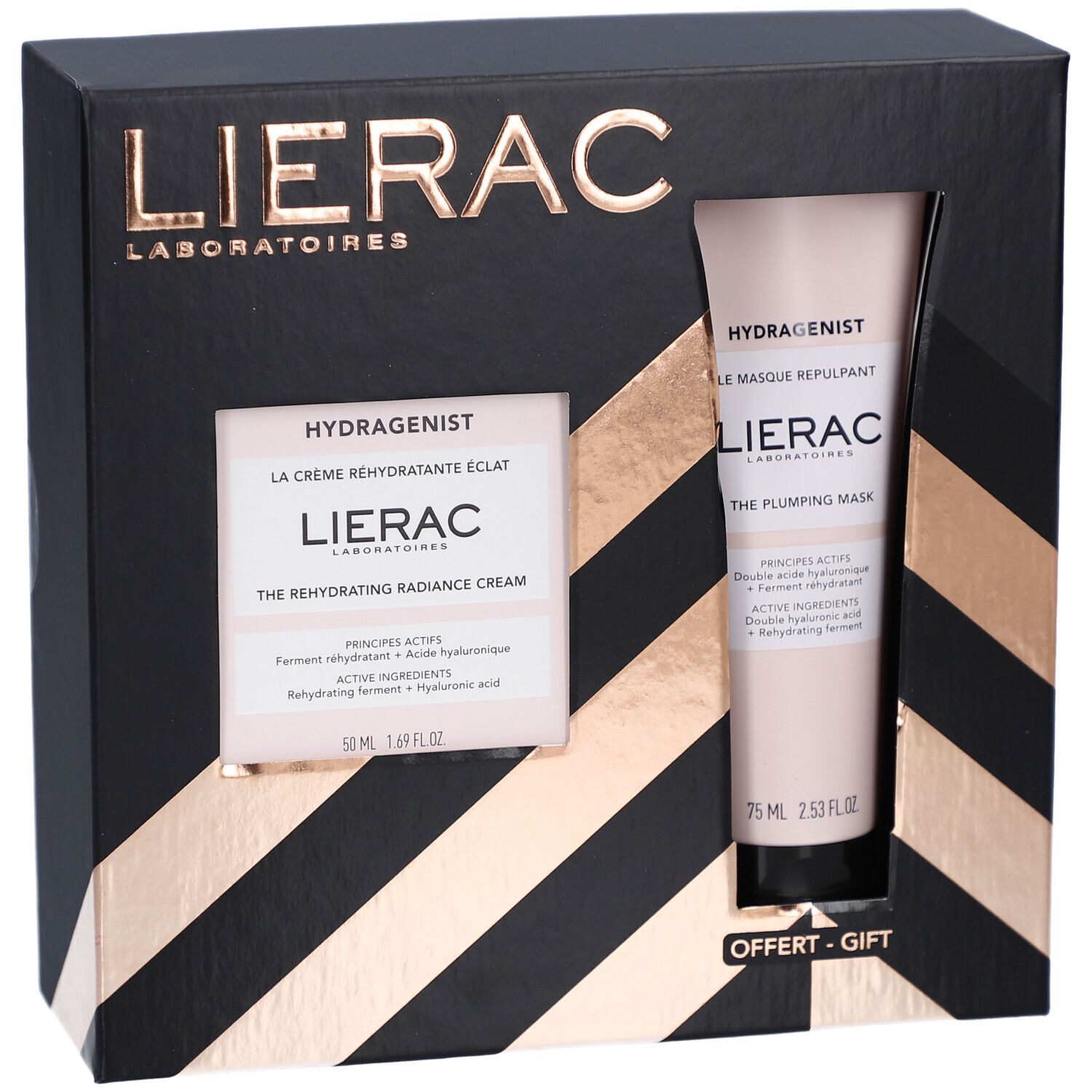 Geschenkset mit Creme und Maske. Schwarze Schachtel mit Fenster. Goldfarbene Akzente. "OFFERT - GIFT".