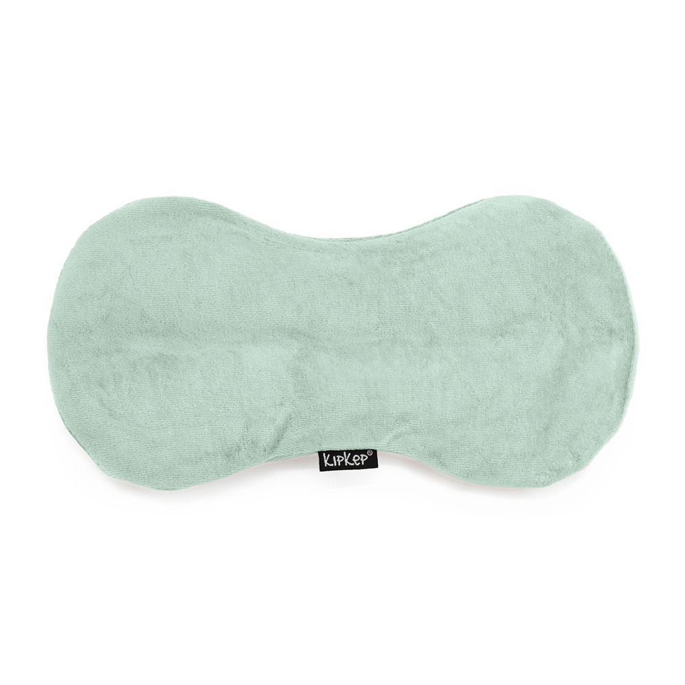Coussin chauffant vert clair en forme de haricot. Logo Kipkep en bas.