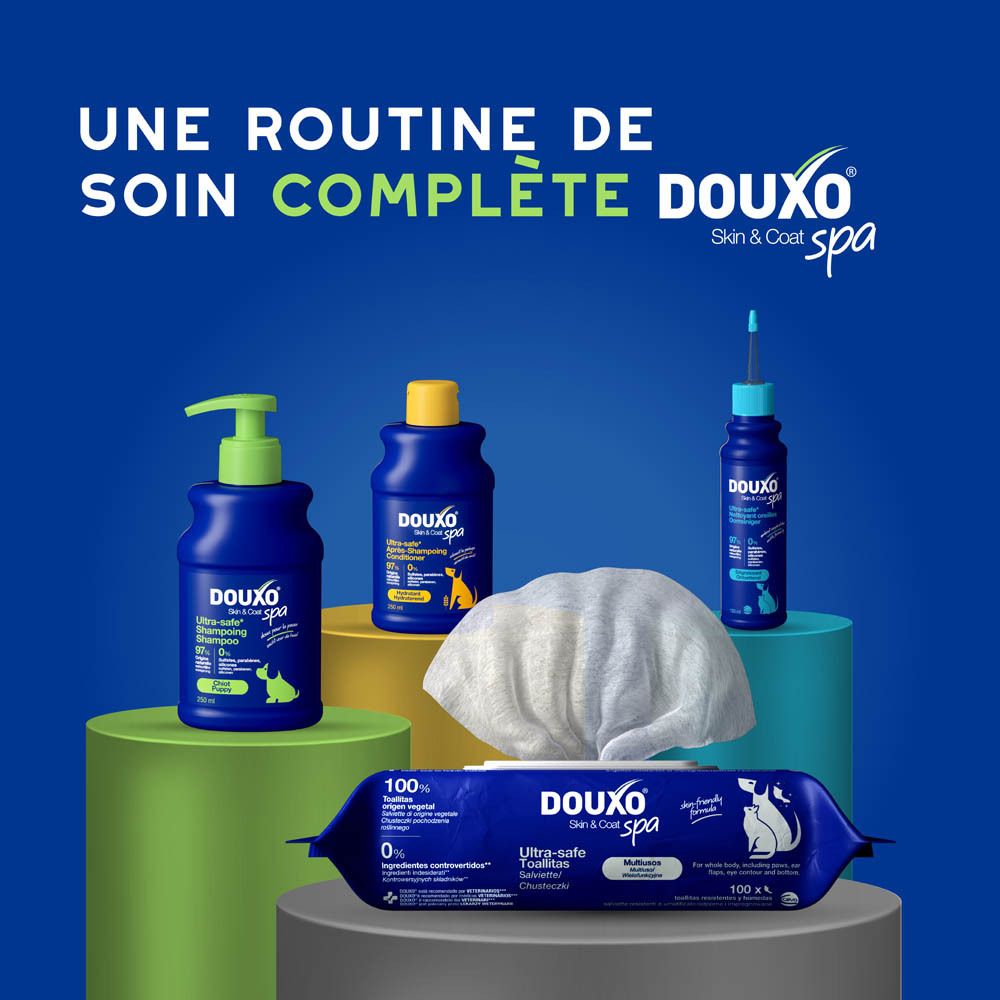 Shampoing Douxo Spa pour chiots, flacon bleu avec distributeur à pompe et texte français.