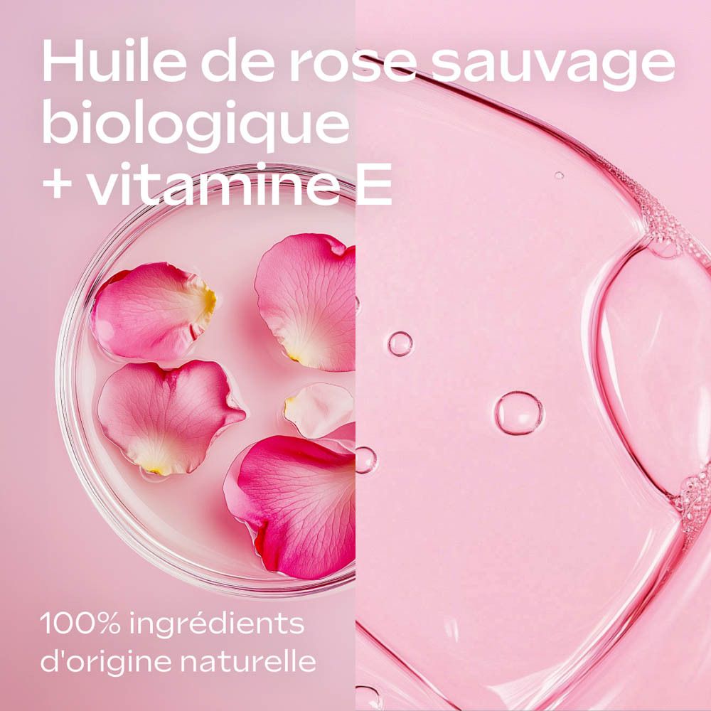 Gros plan de pétales de rose et liquide. Texte: Huile de rose sauvage biologique + vitamine E.