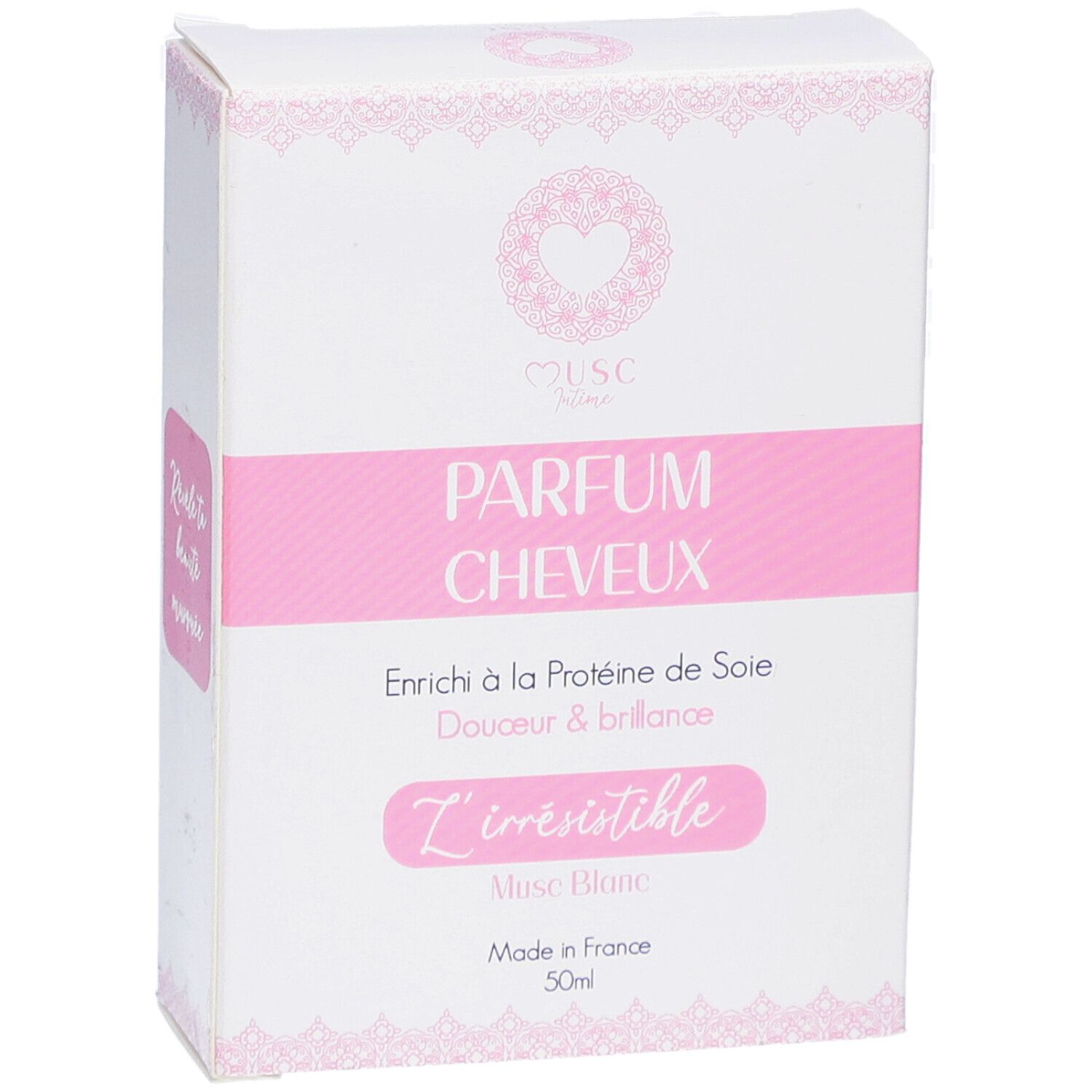 Weißer Karton mit rosa Akzenten. Text: PARFUM CHEVEUX, L'irrésistible, Musc Blanc, Made in France, 50ml.