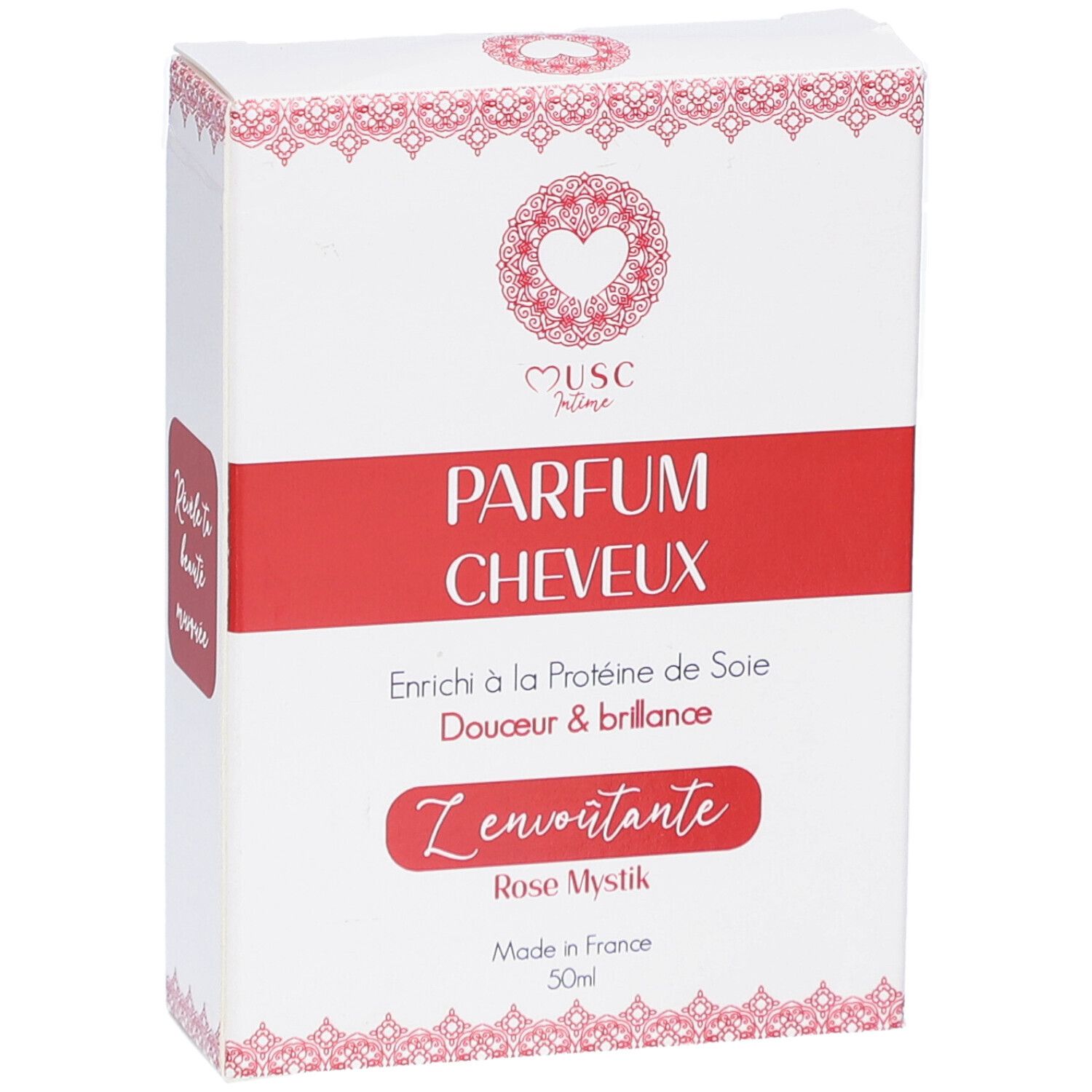 Weißer Karton mit rotem Streifen. Aufschrift: PARFUM CHEVEUX. Enthält Seidenproteine. Rose Mystik. Made in France. 50ml.