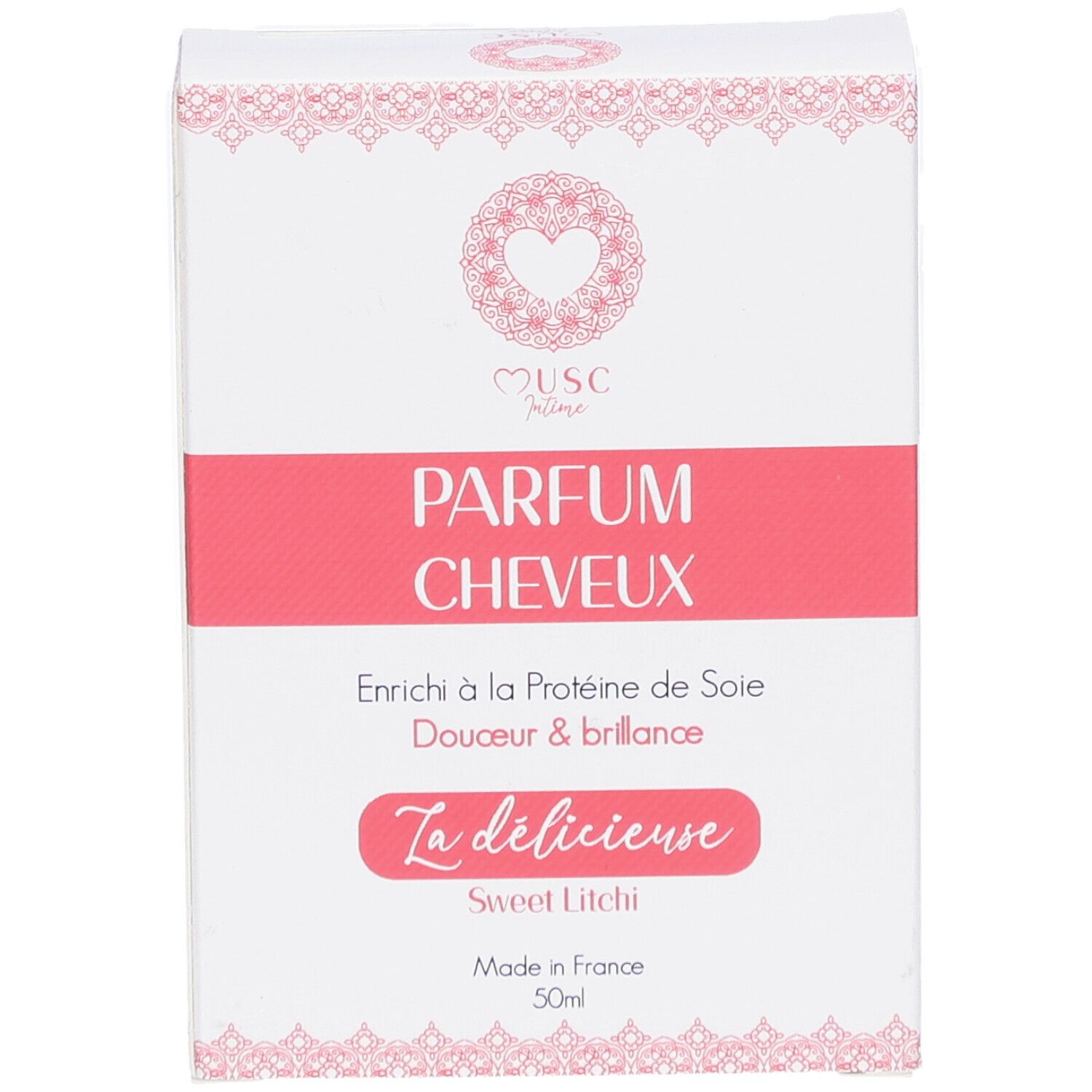 Weißer Karton mit rosa Akzenten. Text: "Musc Intime Parfum Cheveux". "La délicieuse Sweet Litchi". Hergestellt in Frankreich.