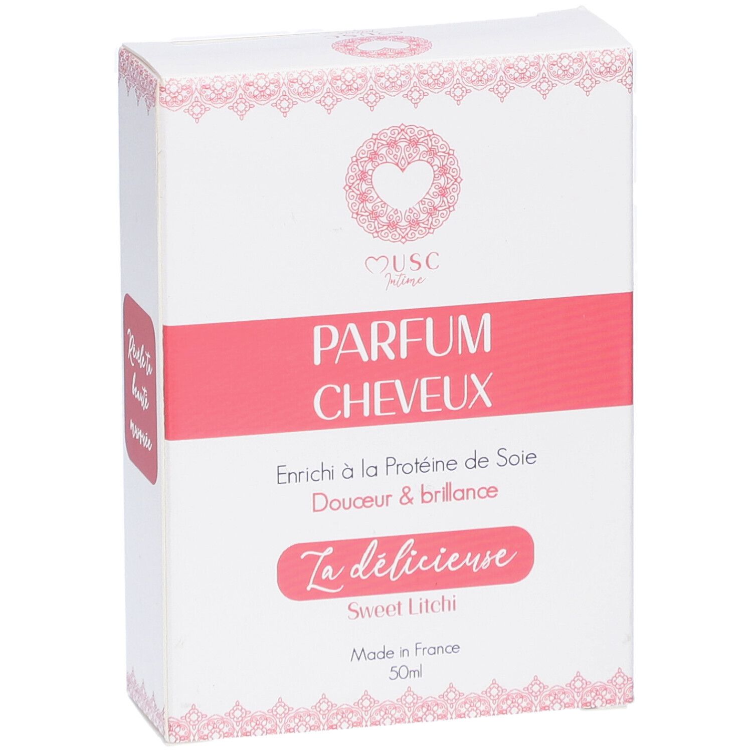 Weißer Karton mit rosa Akzenten. Text: "Musc Intime Parfum Cheveux". "La délicieuse Sweet Litchi". Hergestellt in Frankreich.