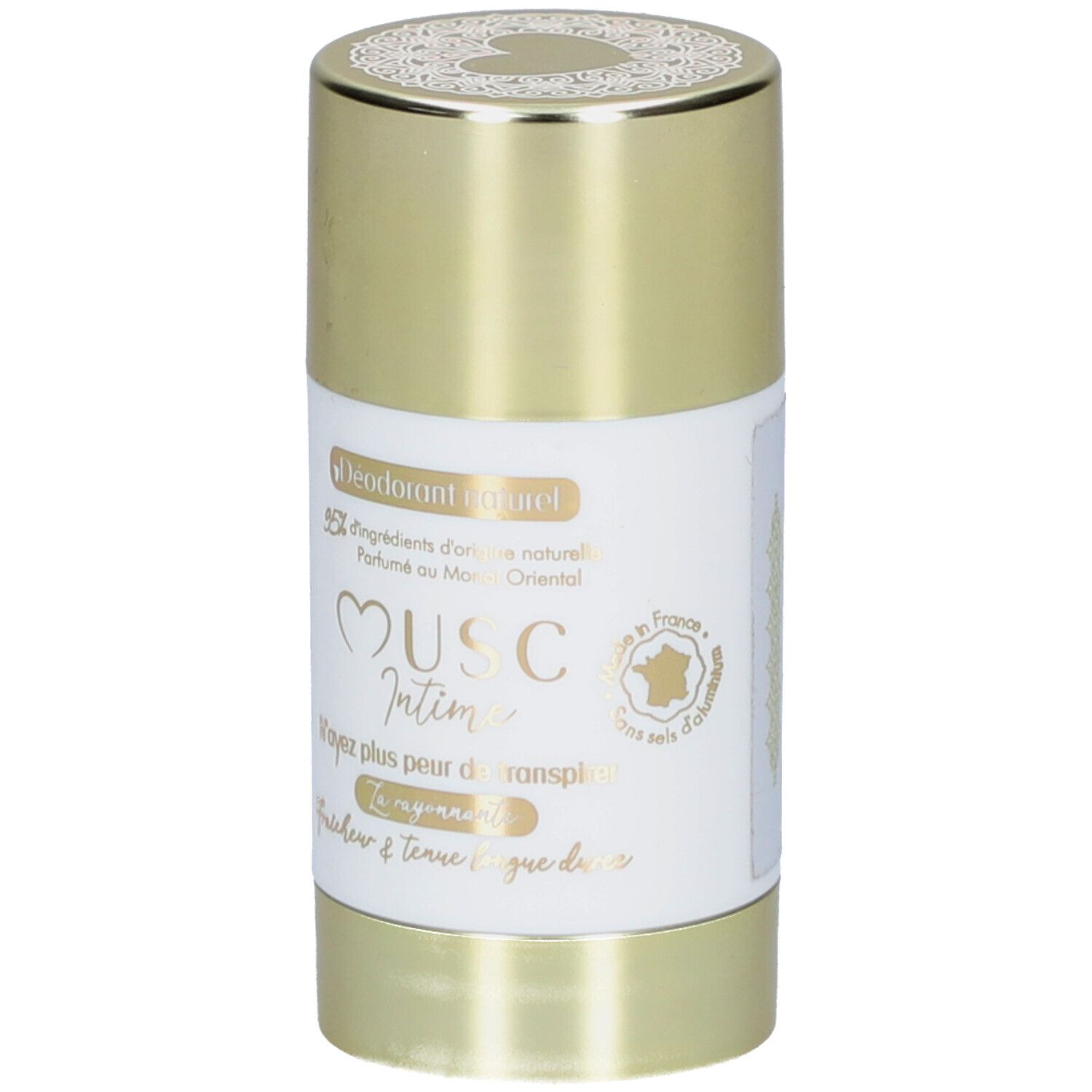 Stick déodorant, capuchon doré. Étiquette blanche avec nom et texte du produit. "Musc Intime" est visible.