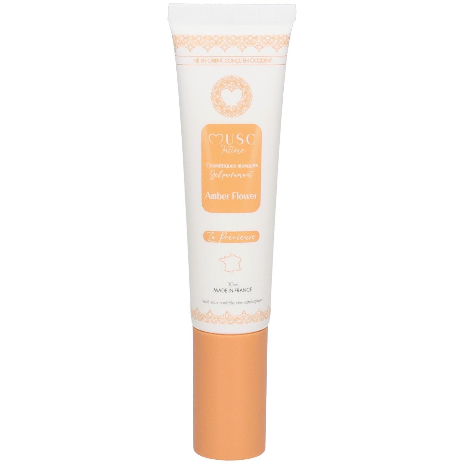 Weiße Tube mit orangefarbenem Verschluss, "MUSC Nuit Amber Flower" Aufschrift.