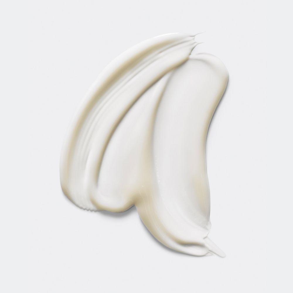 Sérum blanc, texture crémeuse. Sur fond clair. Nom de la marque ou du produit non visible.