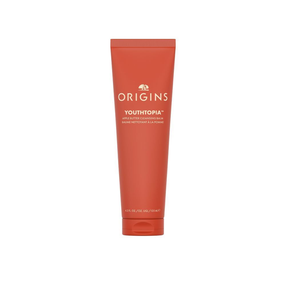 Tube rouge avec texte blanc. Inscription: ORIGINS YOUTHTOPIA Apple Butter Cleansing Balm. 125 ml.