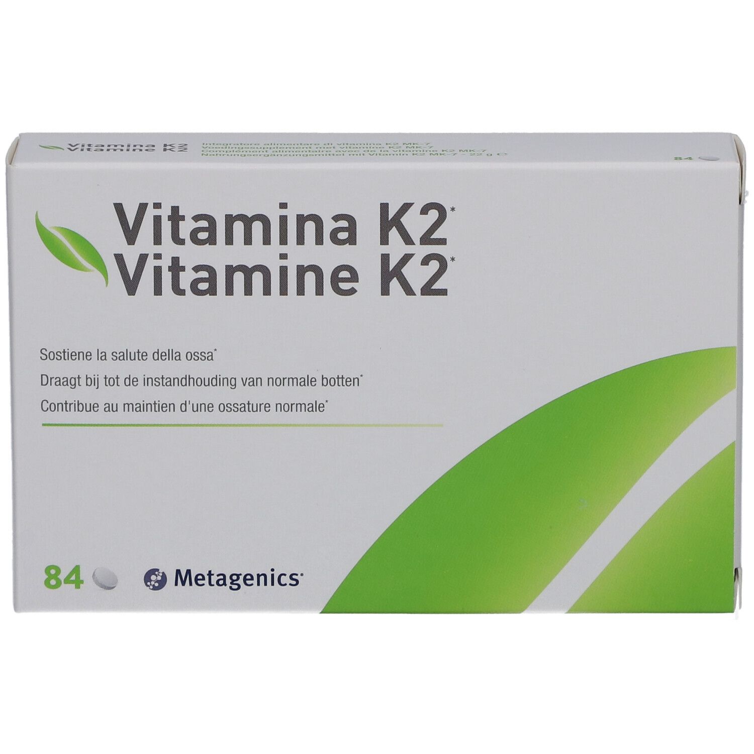 Weißer Karton mit "Vitamina K2"-Aufdruck. Enthält 84 Tabletten. Marke: Metagenics. Grünes Blatt-Logo.