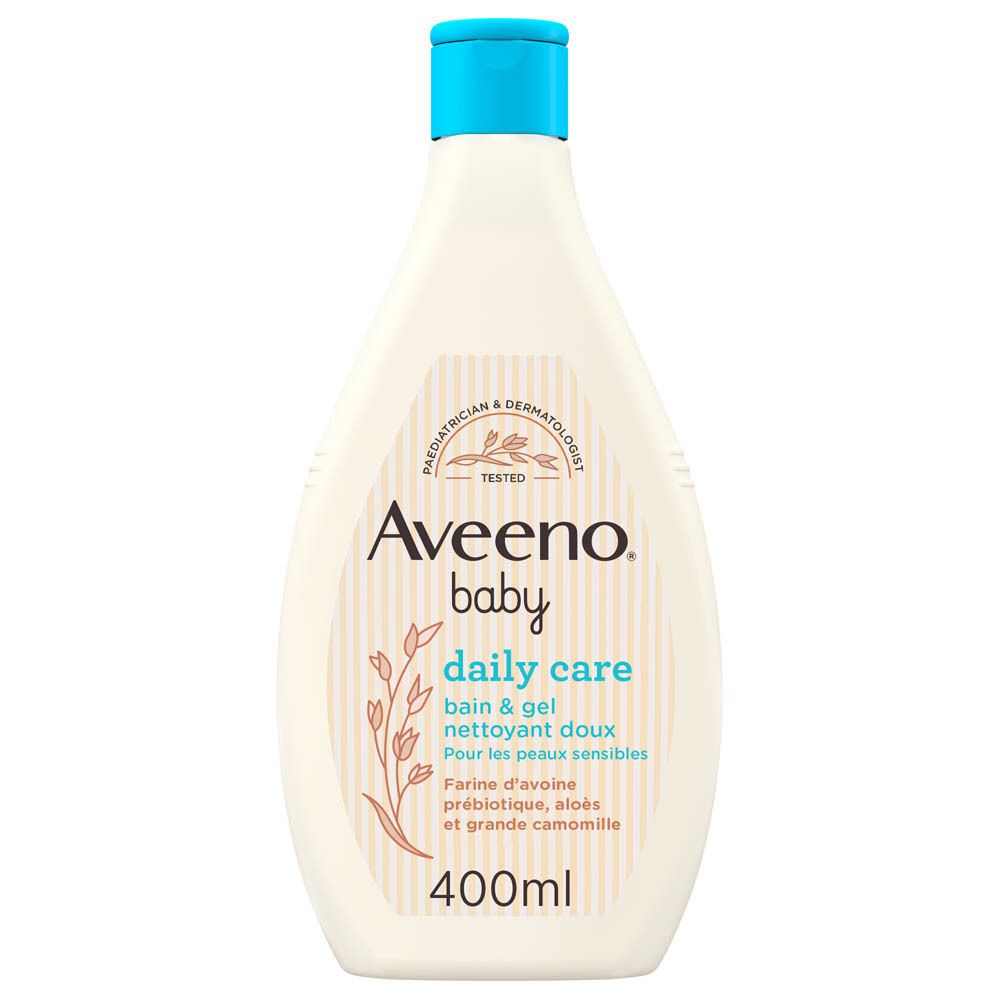 Flacon Aveeno Baby Daily Care Bain & Gel Nettoyant Doux. Bouchon bleu. Inscription: Farine d'avoine prébiotique, aloès et grande camomille. 400ml.