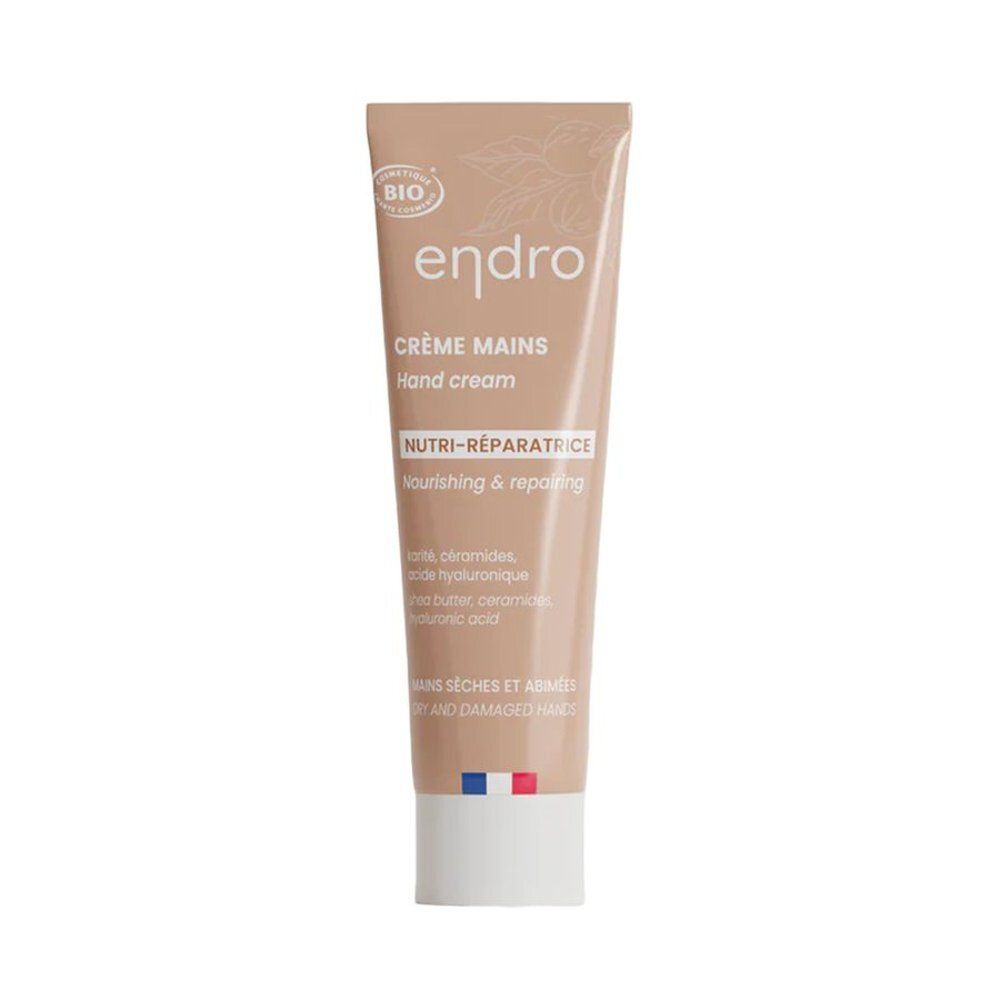 Tube beige de crème pour les mains. Inscription: endro, Crème Mains, Nutri-Réparatrice, Hand cream. Drapeau français.
