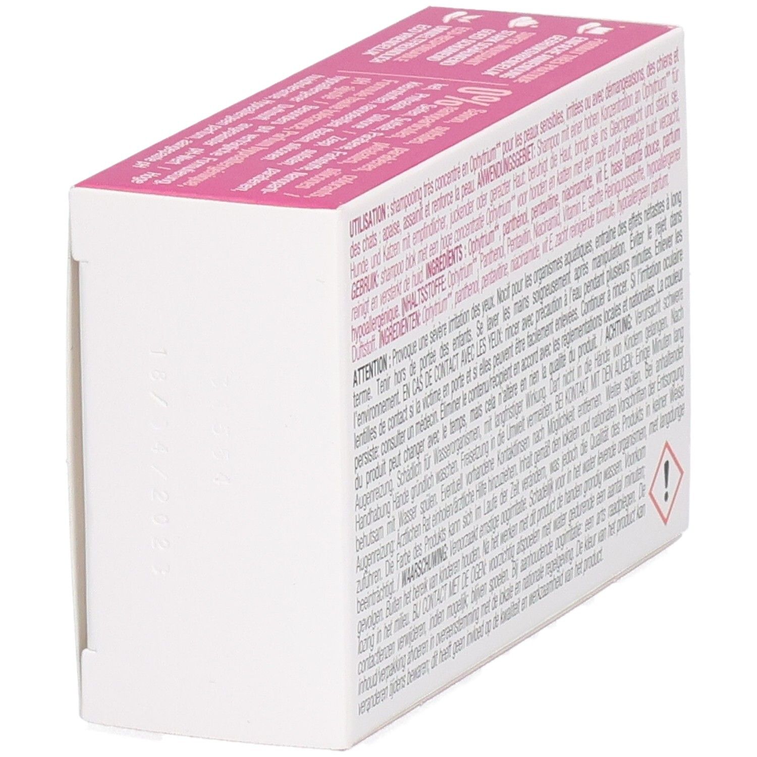 Seitenansicht der Verpackung. Rosa-weiße Schachtel mit Text. Warnhinweis-Symbol.