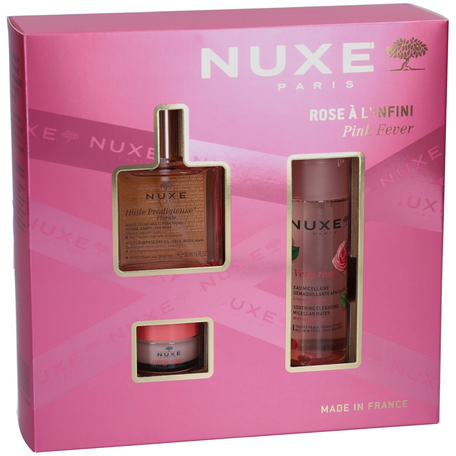 Coffret rose avec trois produits. Visible : logo Nuxe, noms de produits et les produits eux-mêmes.