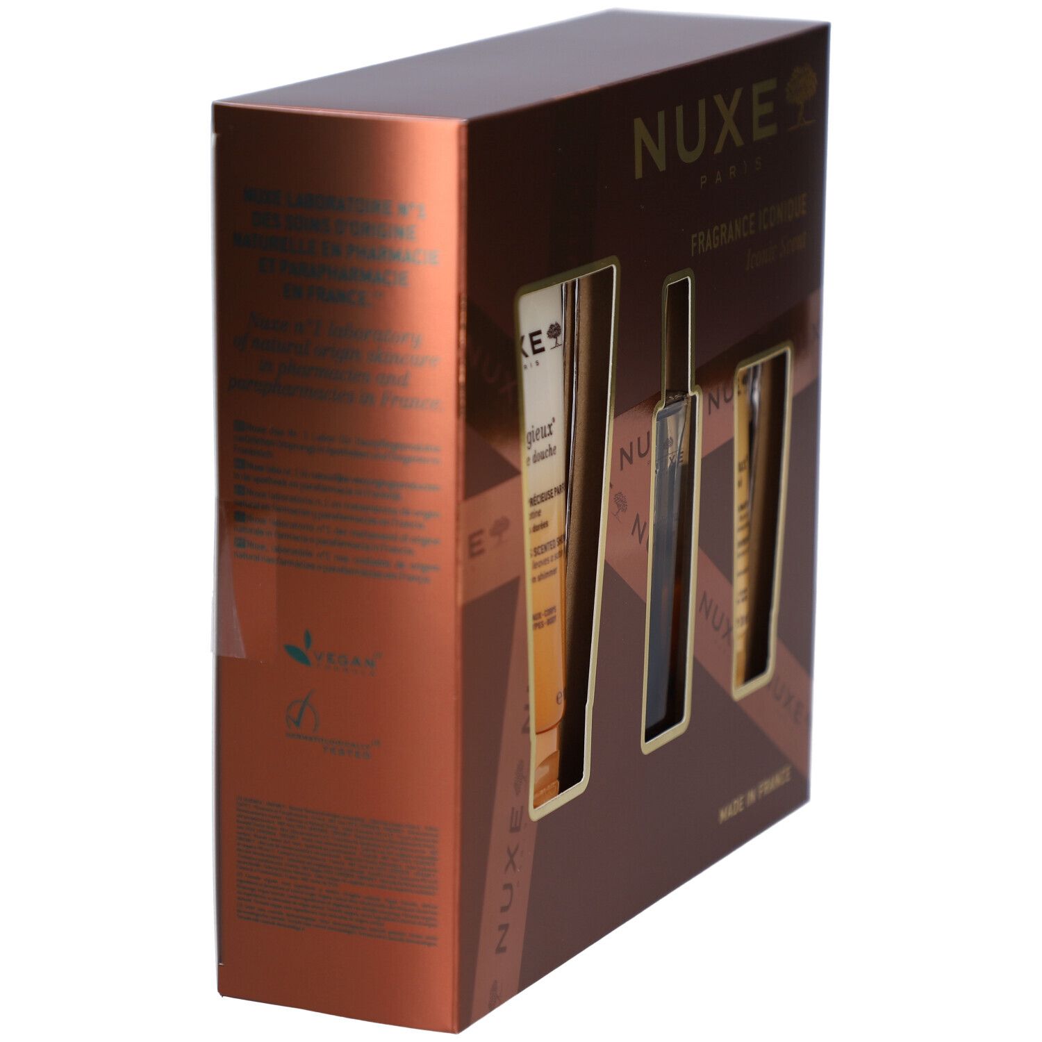 Boîte cadeau marron avec trois ouvertures. Contient des produits Nuxe. Vue latérale avec texte et logo. Fabriqué en France.