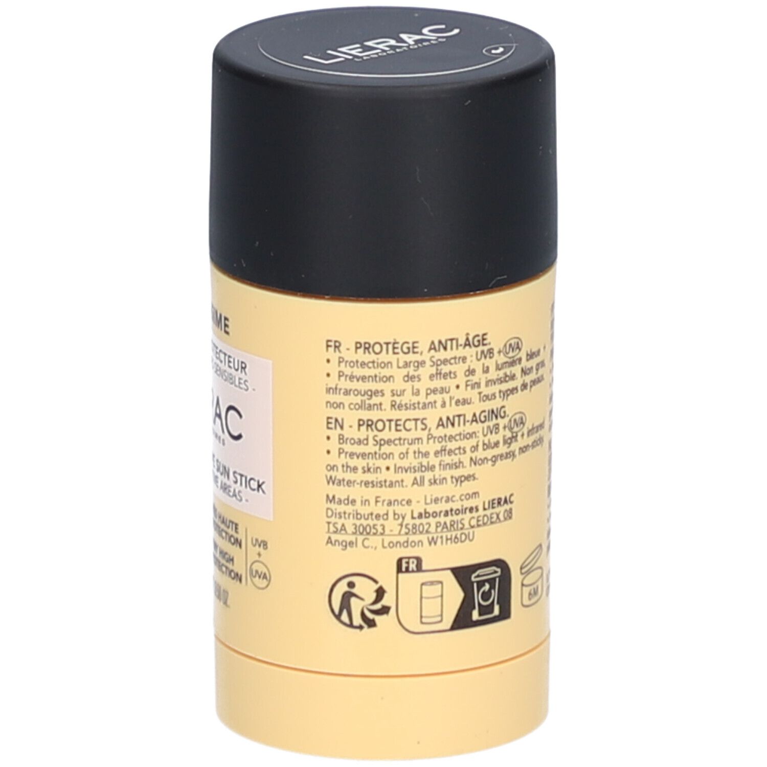 Zylindrischer Sonnenschutz-Stick. Gelbe Verpackung mit schwarzem Deckel. Text in mehreren Sprachen.