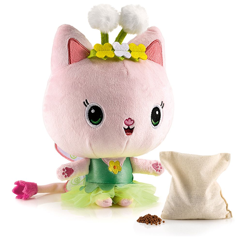 Peluche chat avec couronne de fleurs et ailes, à côté d'un sachet de granulés.