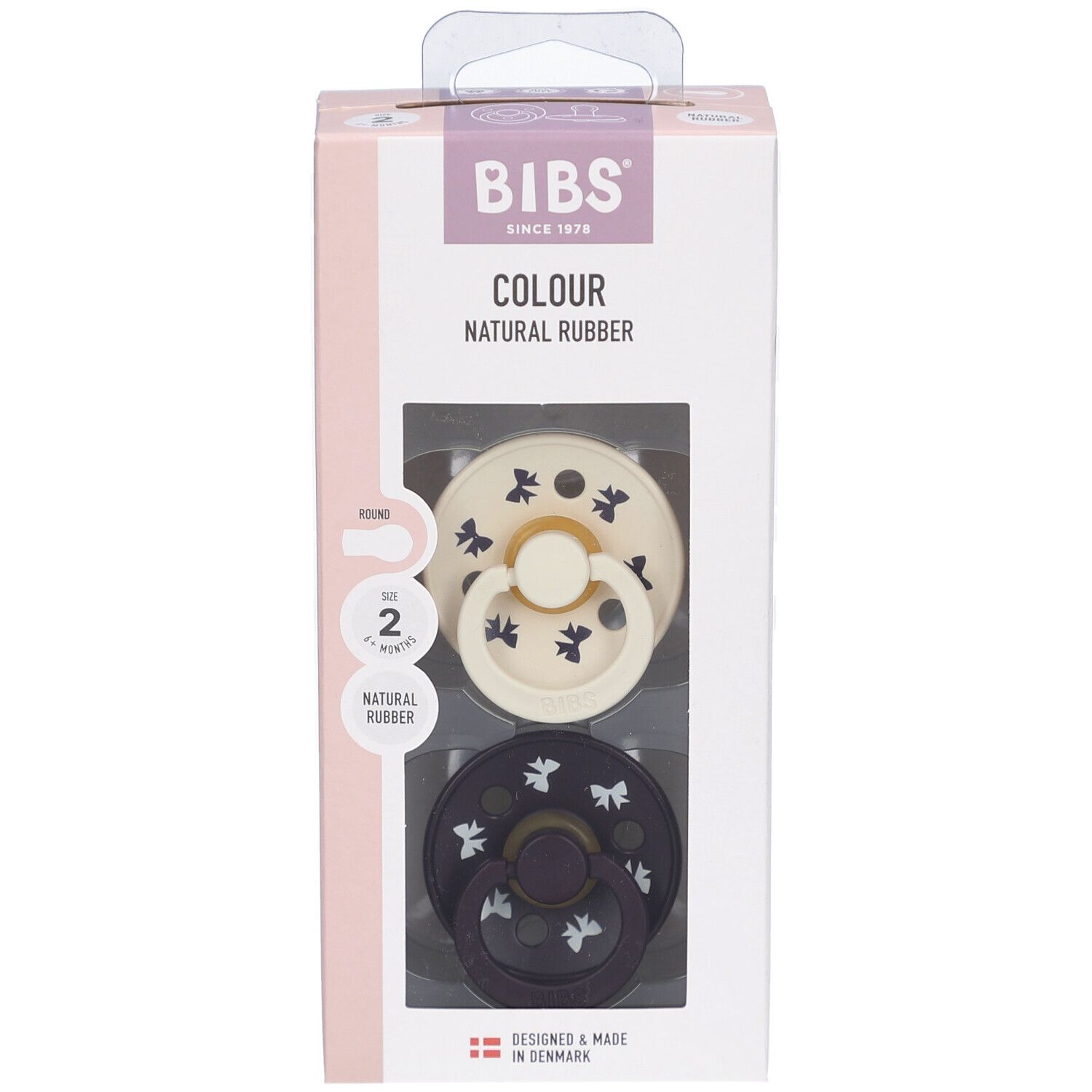 Emballage de deux sucettes. Visibles: sucette crème et bleu foncé avec motifs. Marque BIBS.