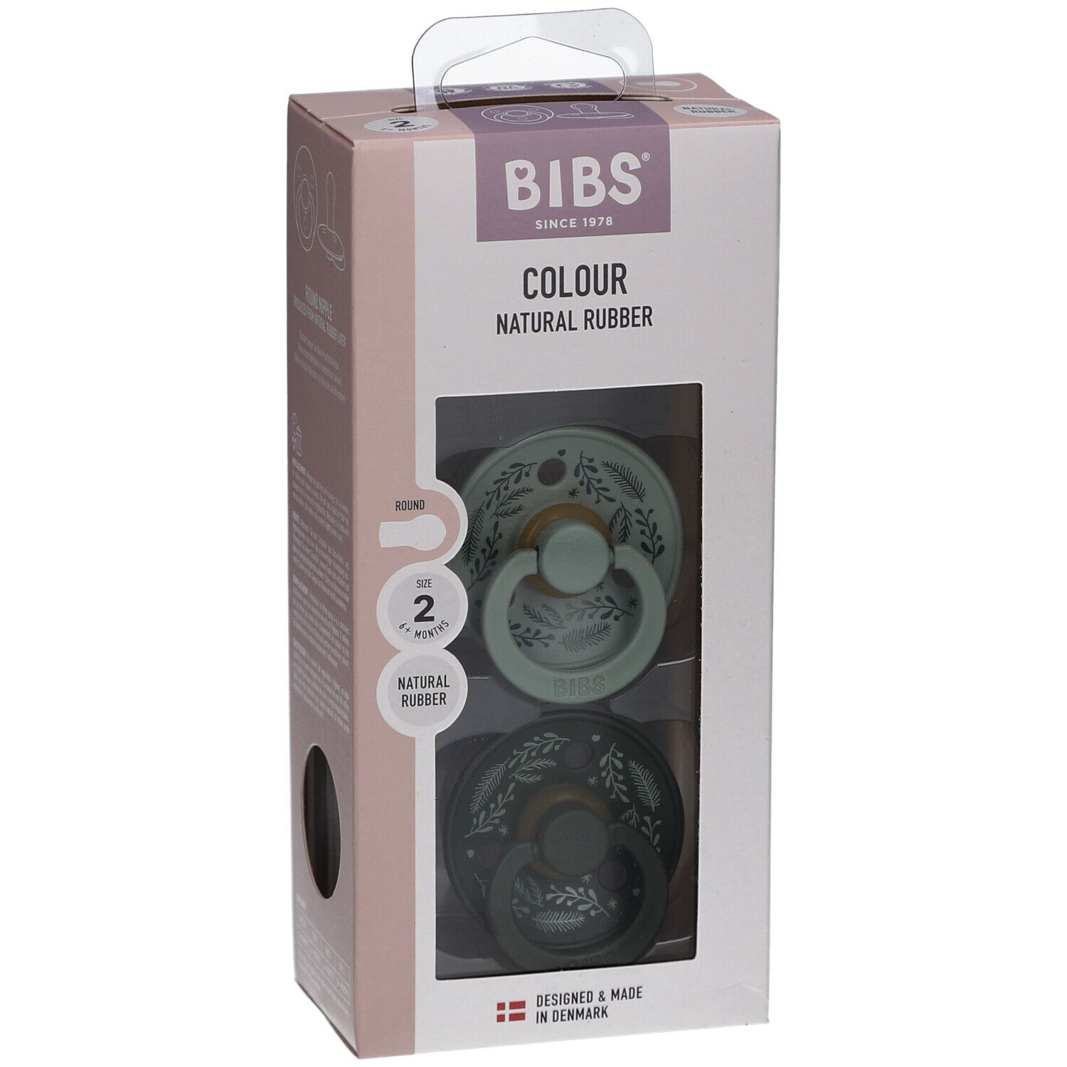 Verpackung mit zwei Schnullern. Marke BIBS, Schriftzug „COLOUR NATURAL RUBBER“. Größe 2, 6-18 Monate. Grün und dunkelgrün mit Blättermuster.