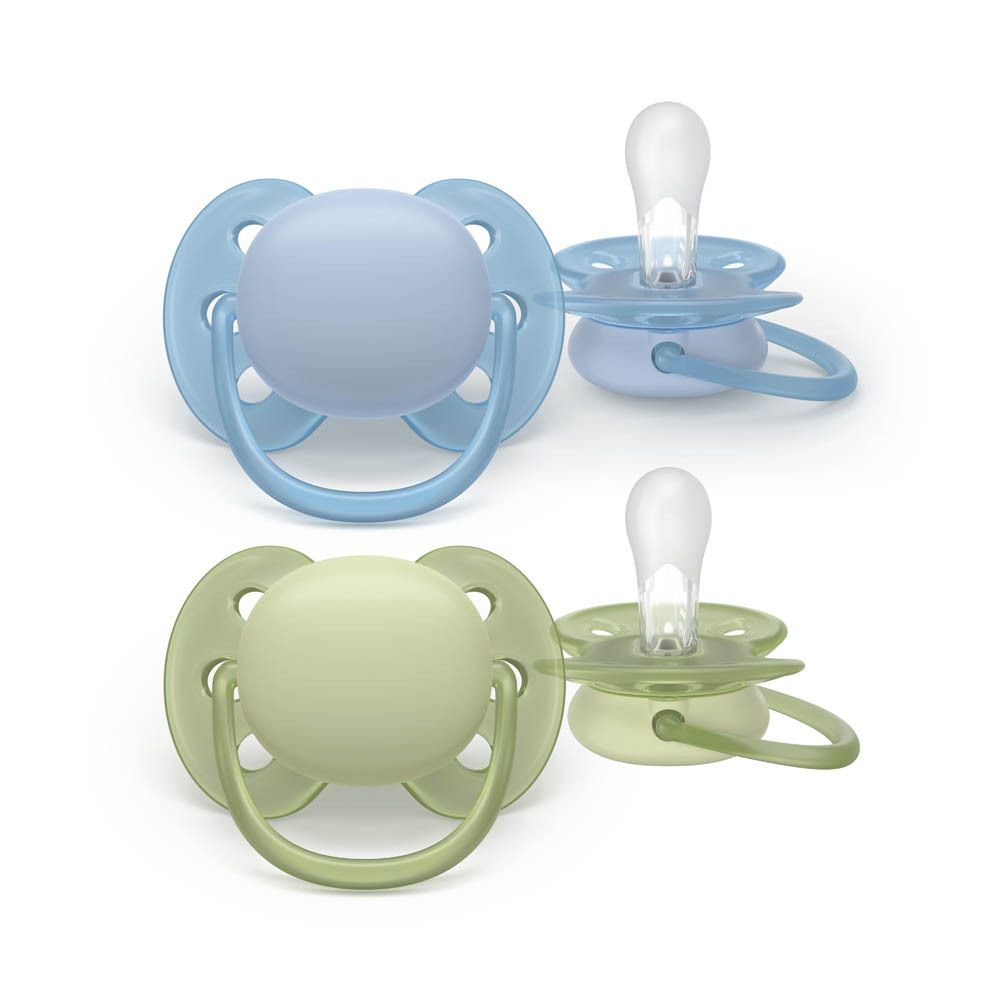 Deux sucettes Philips Avent, bleu clair et vert, dans une boîte de rangement transparente.