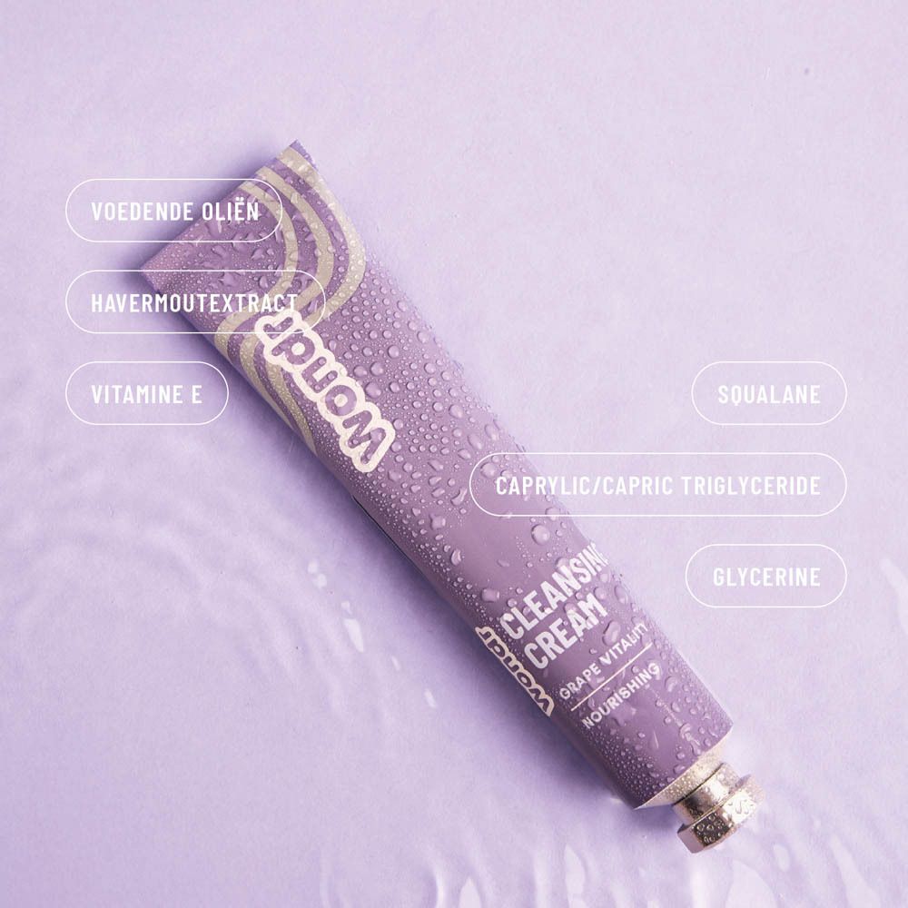 Lila Tube mit Inhaltsstoff-Labels: "Voedende oliën", "Havermoutextract", "Vitamine E", "Squalane", "Caprylic/capric triglyceride", "Glycerine".