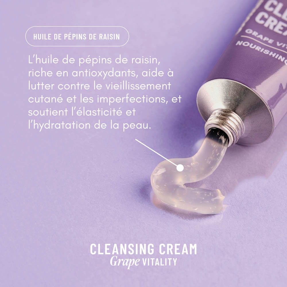 Gros plan du tube avec crème extrudée. Texte: "Huile de pépins de raisin" et description. Sur fond violet.