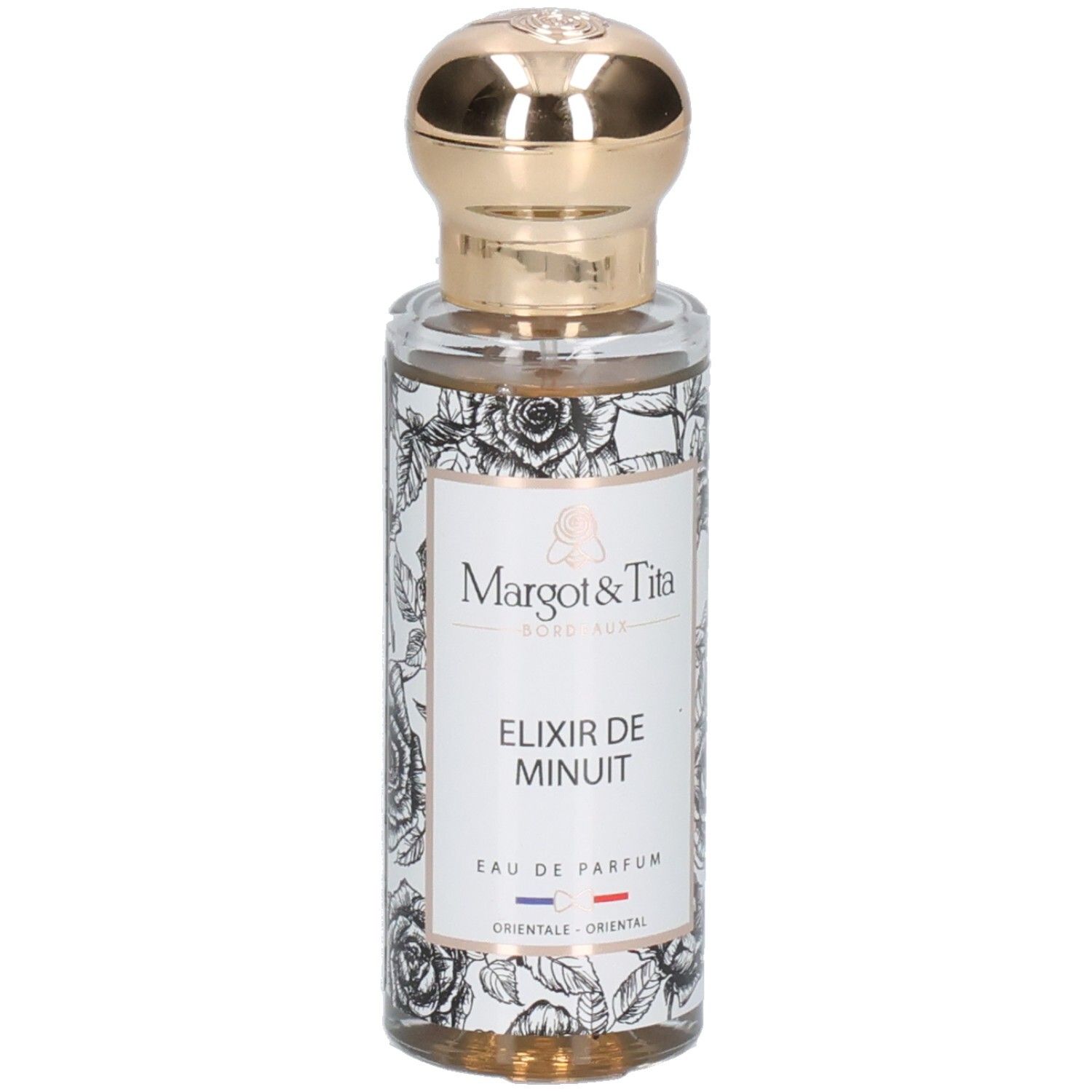 Margot & Tita Elixir de Minuit Eau de Parfum in Glasflasche mit goldenem Verschluss und Rosenmuster.