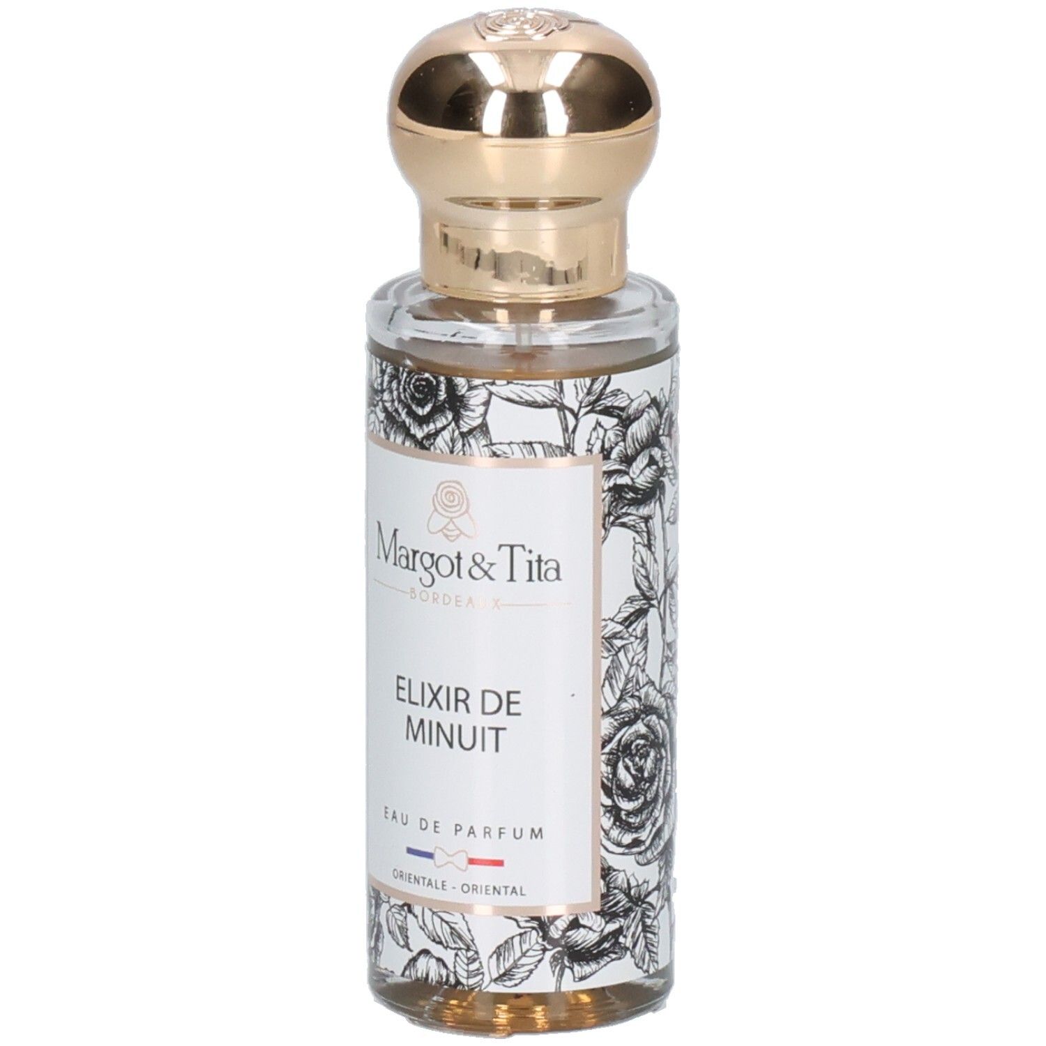 Margot & Tita Elixir de Minuit Eau de Parfum Flasche mit goldenem Verschluss und floralem Design.