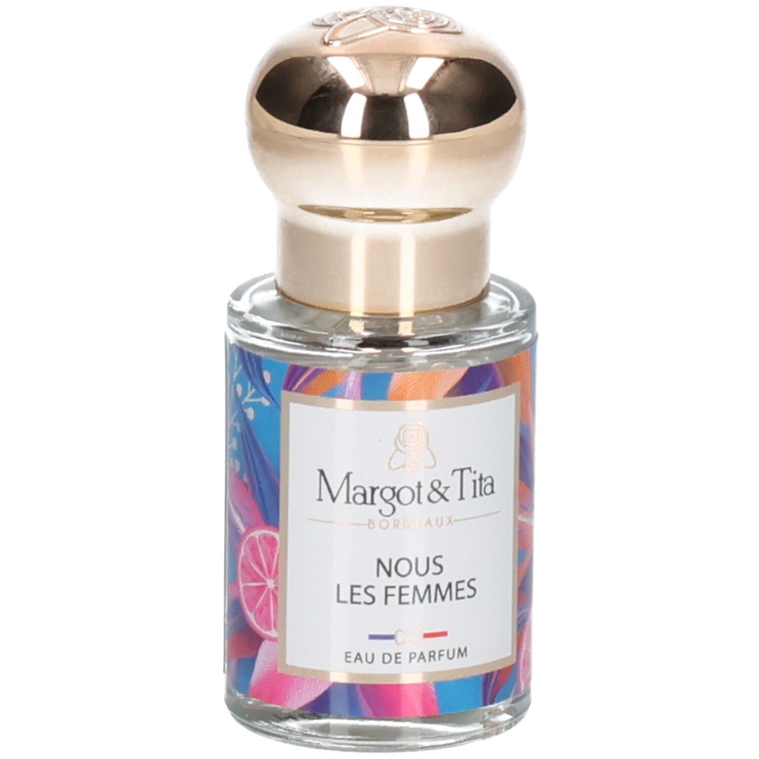 Parfümflakon mit goldenem Verschluss und buntem Etikett mit der Aufschrift 'Margot & Tita NOUS LES FEMMES EAU DE PARFUM'.