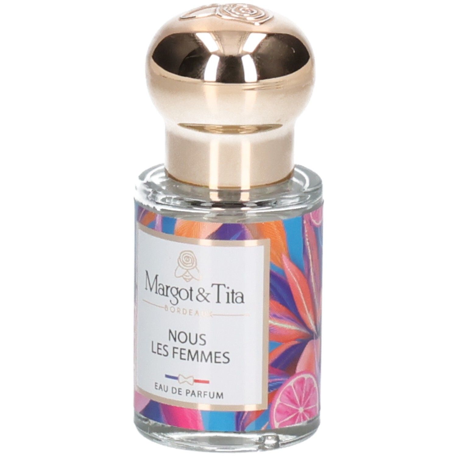 Margot & Tita Eau de Parfum Flasche mit goldenem Verschluss und buntem Blumenmuster.
