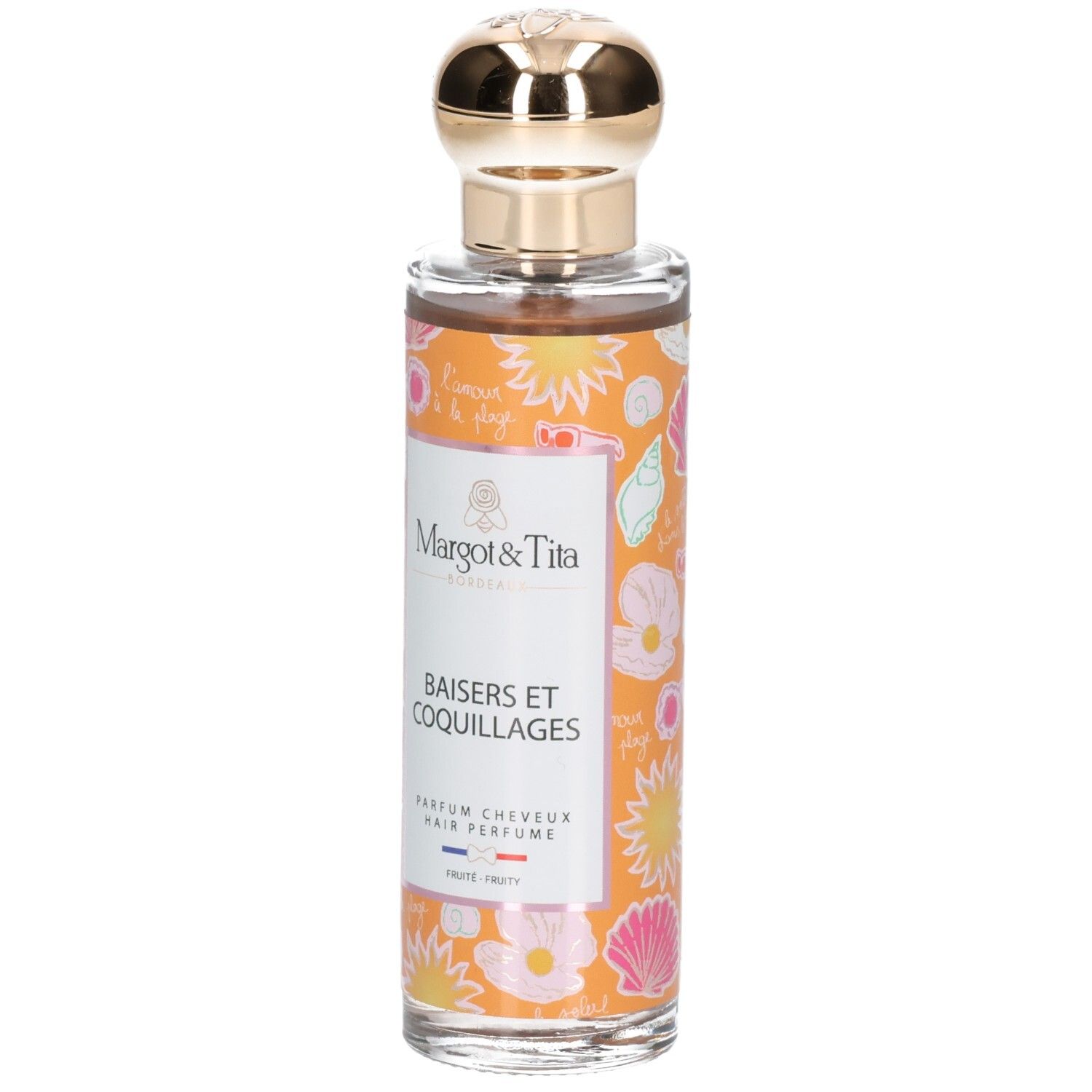 Parfum pour cheveux en flacon de verre avec bouchon doré. Étiquettes oranges décorées de coquillages et fleurs.
