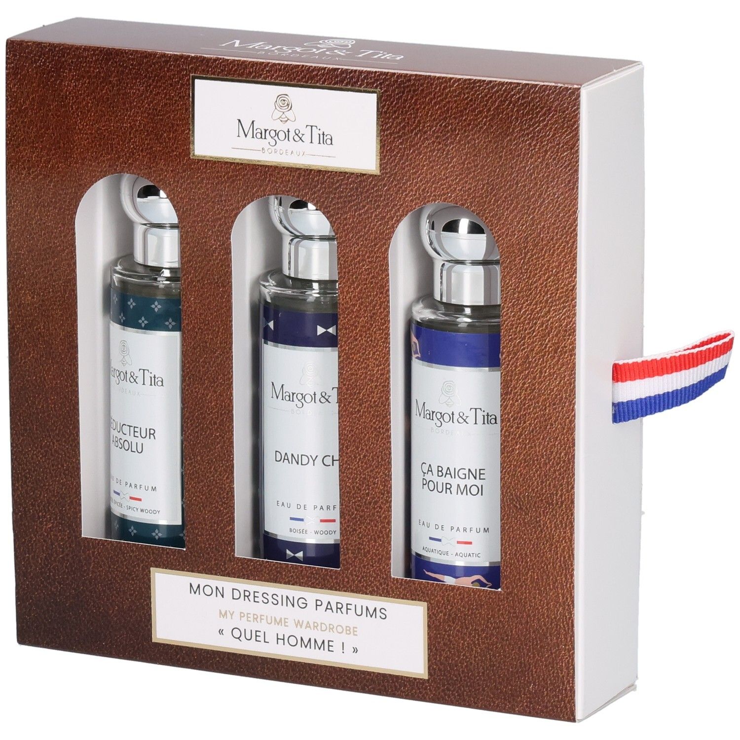 Geschenkbox mit drei Parfümflaschen. Braune Box mit weißer Innenseite. Französische Flagge als Band.