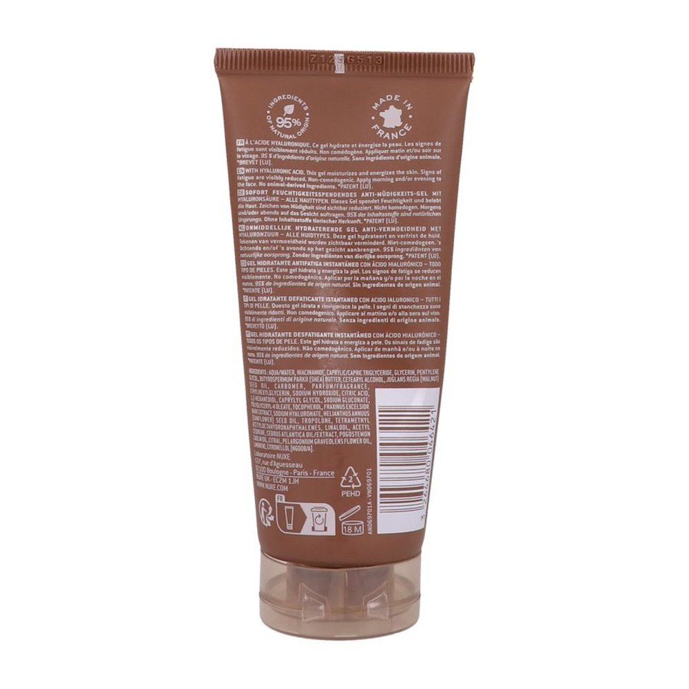 Dos du tube marron. Texte multilingue, ingrédients et code-barres. Fermeture transparente.