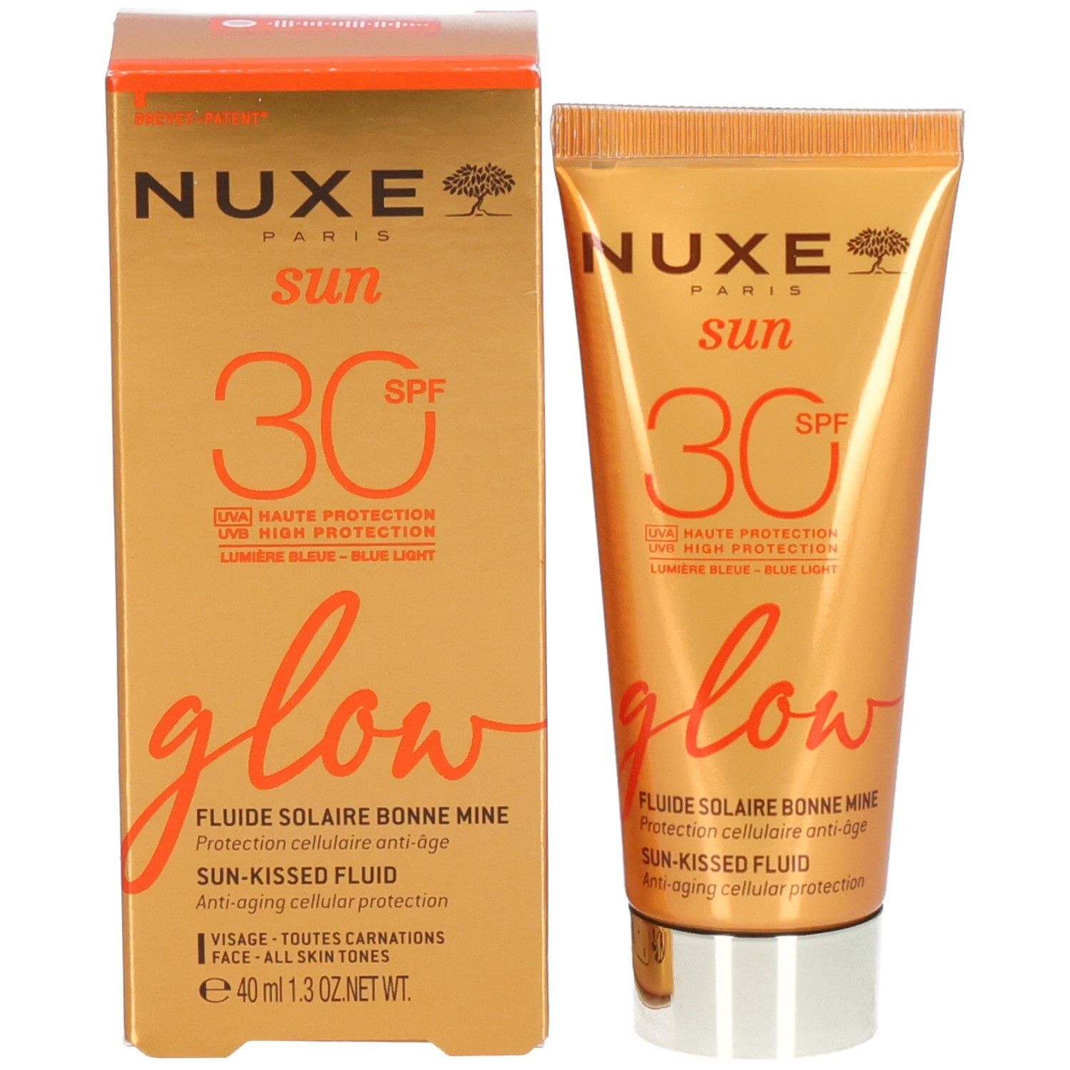 Produkt und Verpackung. Nuxe Sun SPF30 Glow Sonnenfluid und Karton. Orangefarbenes Design.