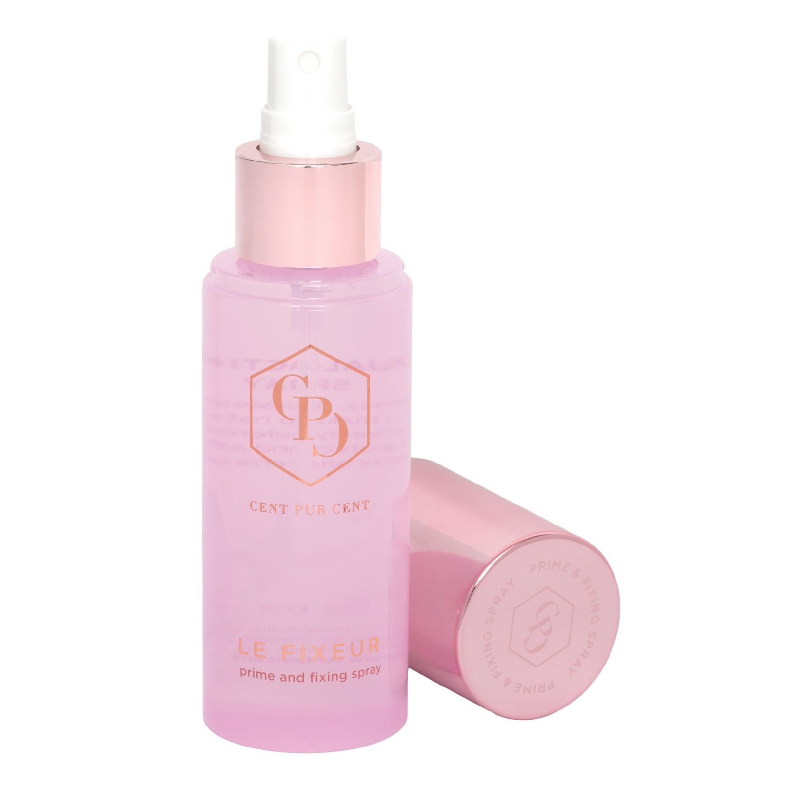 Flacon rose avec bouchon doré rose. Tête de pulvérisation et bouchon à côté.