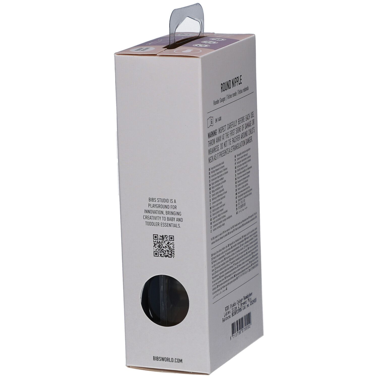 Seitenansicht der Verpackung. Text über Schnuller, Warnhinweise, Herstellerinformationen. Runde Form.