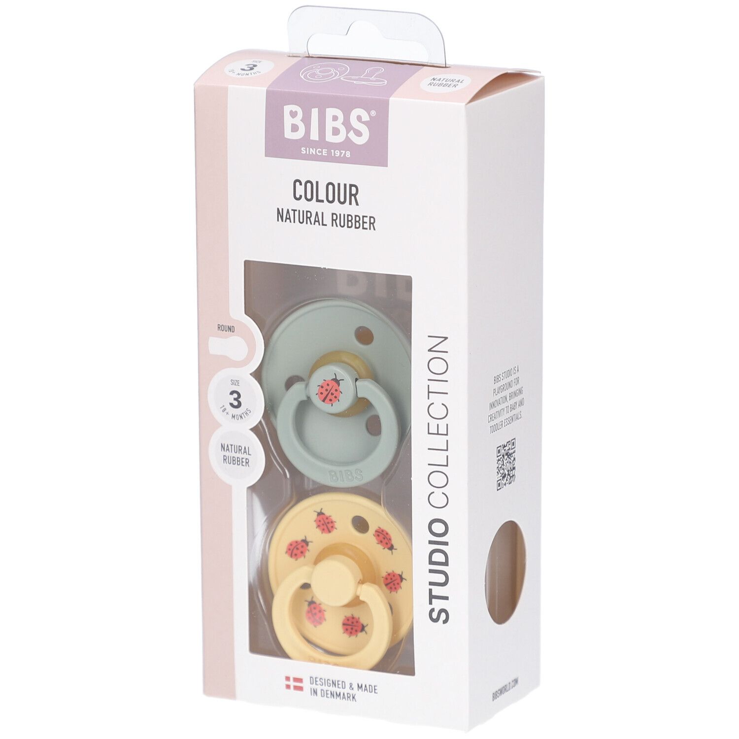 Verpackung mit zwei Schnullern. Grün und gelb mit roten Marienkäfern. Marke BIBS. Alter 18+ Monate.