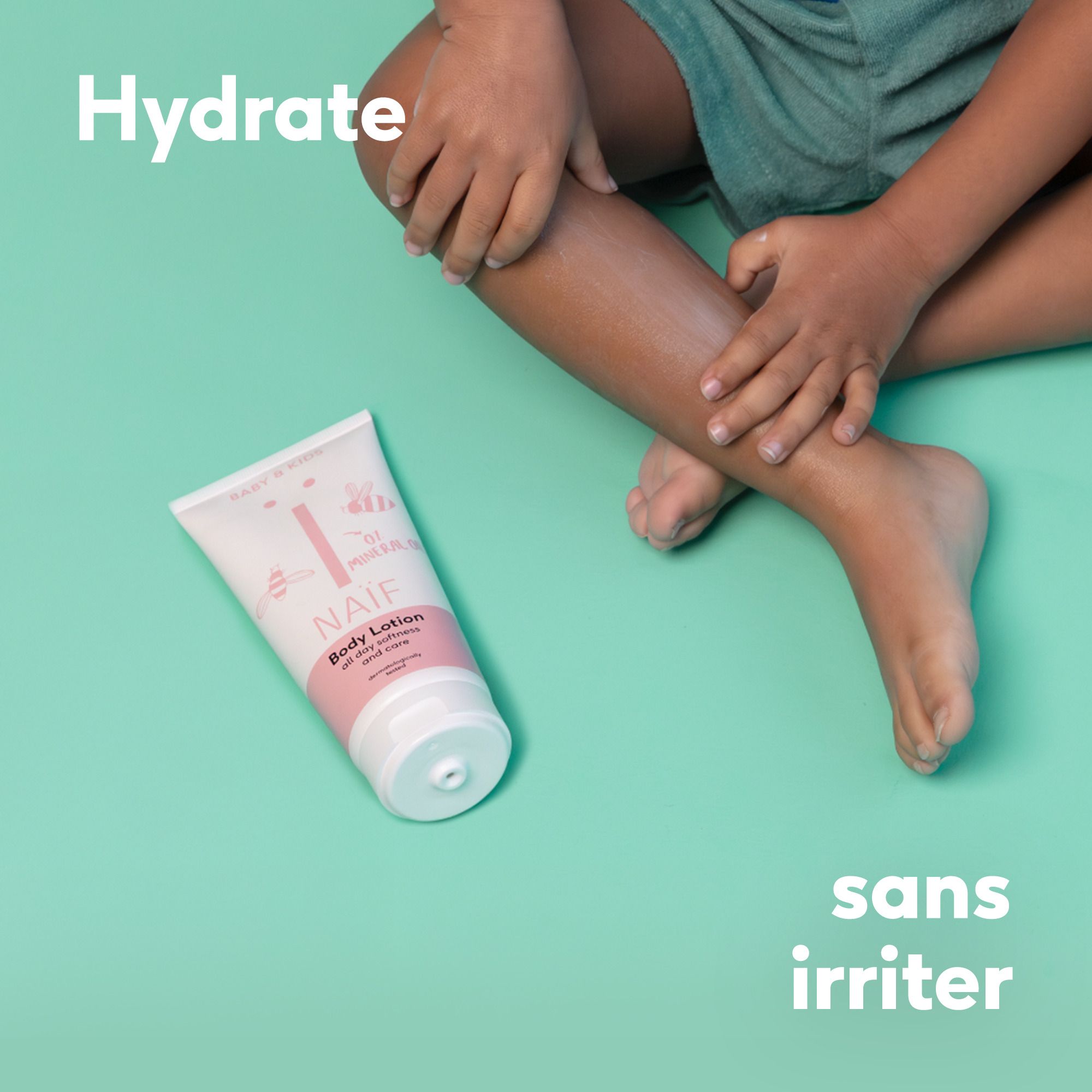 Évaluation : Naïf Lotion pour le corps. 5 étoiles. Texte sur la lotion.