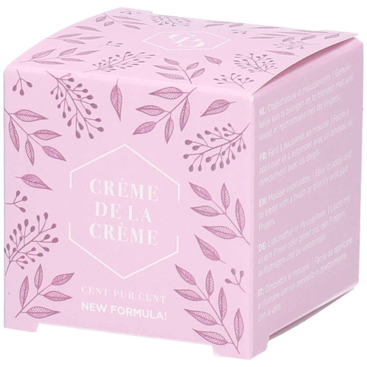 Rosa Verpackung mit floralem Muster. Text: Crème de la Crème, Cent Pur Cent, New Formula. Mehrsprachige Anwendungshinweise.