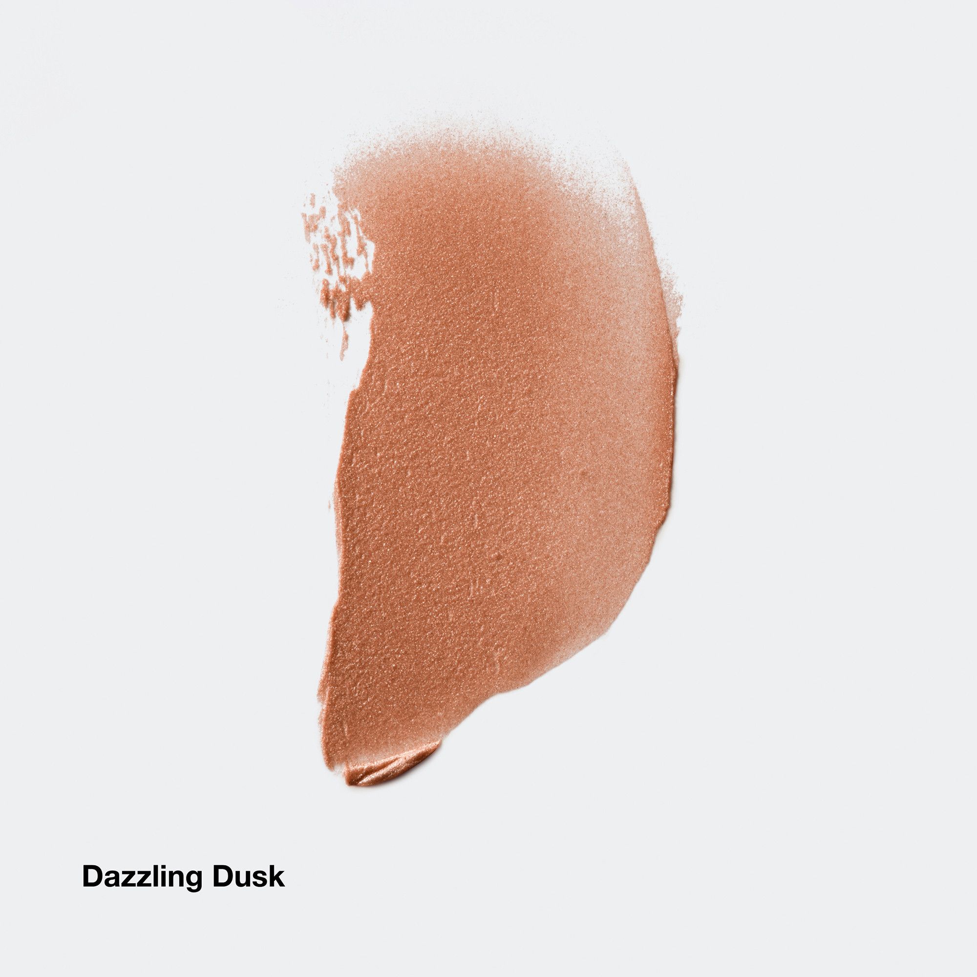 Hautfarbener Highlighter-Strich. Produktname 'Dazzling Dusk' darunter.