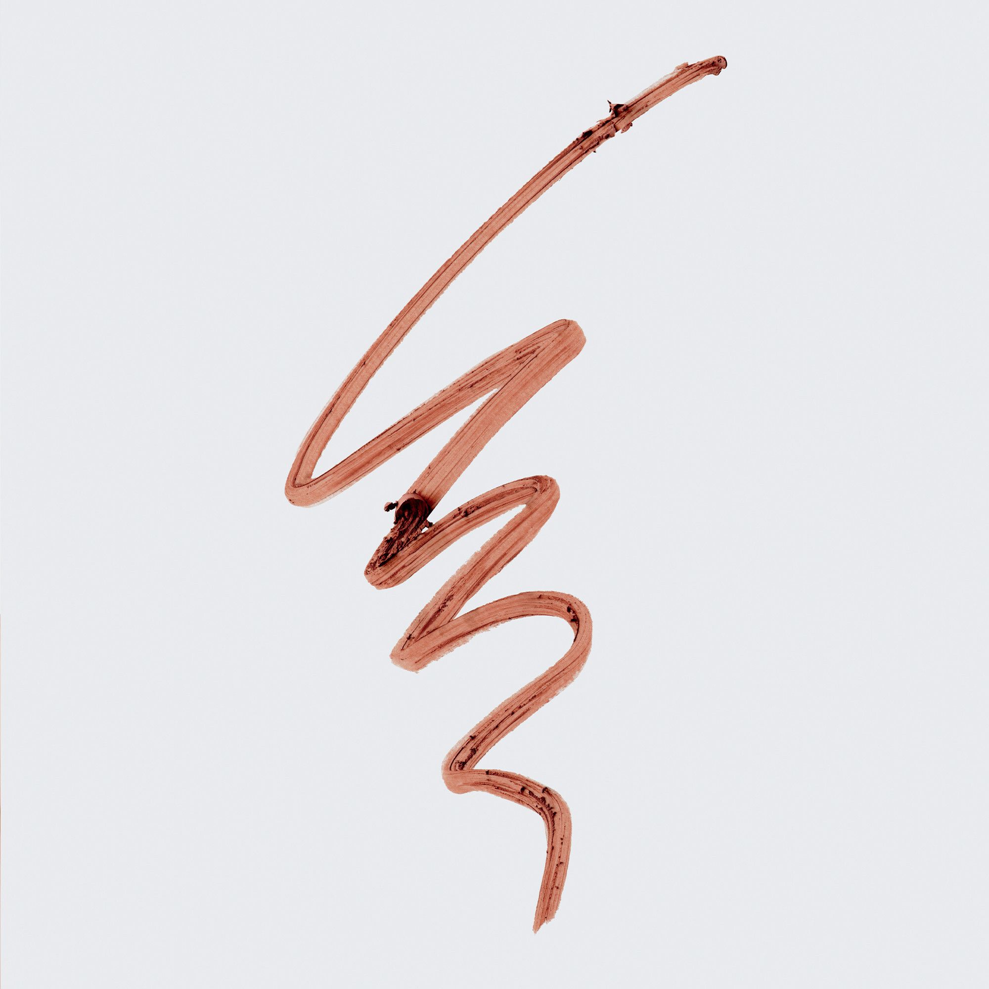 Braune Linie, die mit einem Lipliner gezogen wurde. Die Linie ist wellenförmig und hat eine unregelmäßige Form.